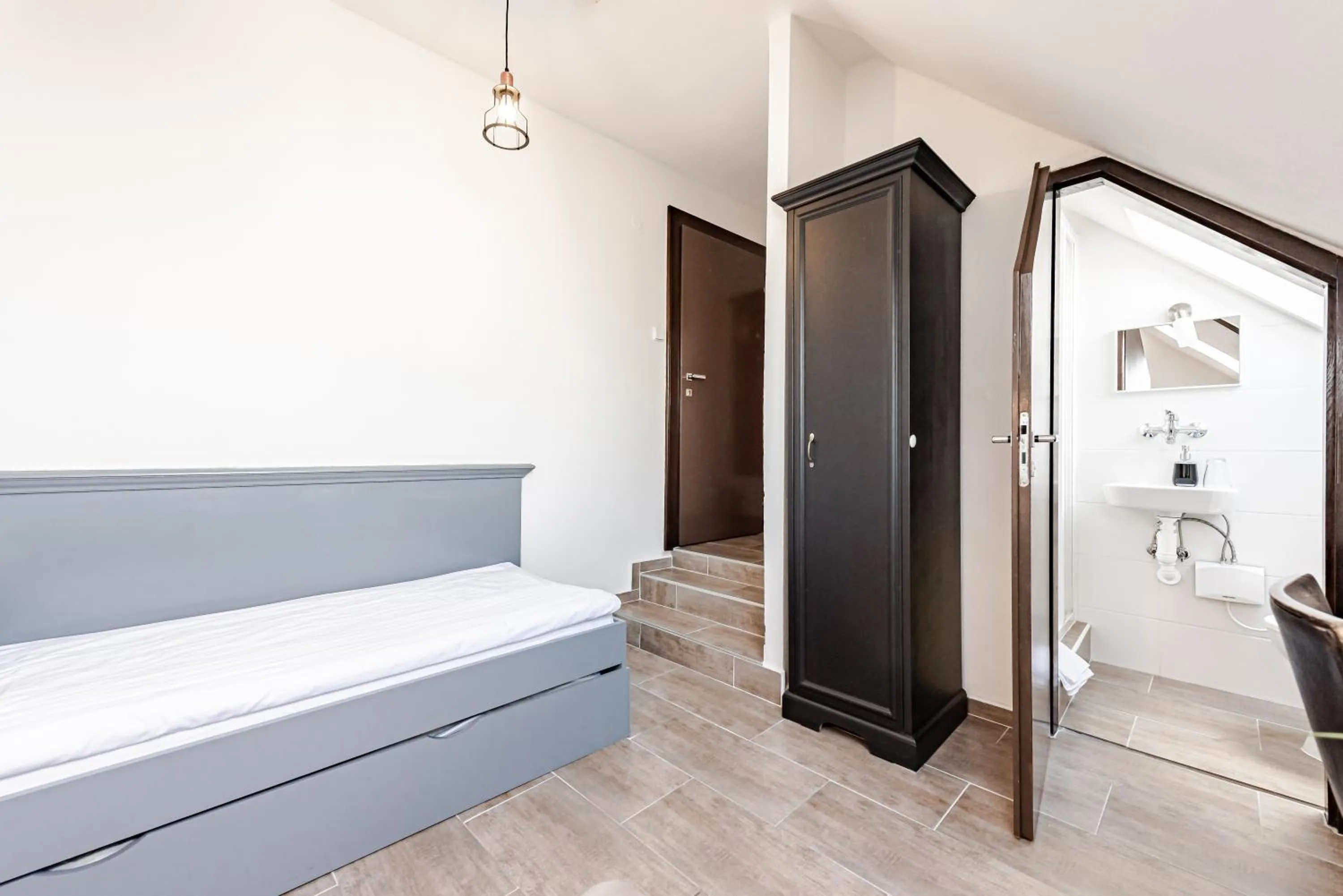 Bathroom, Bed in Hotel Pivoňka