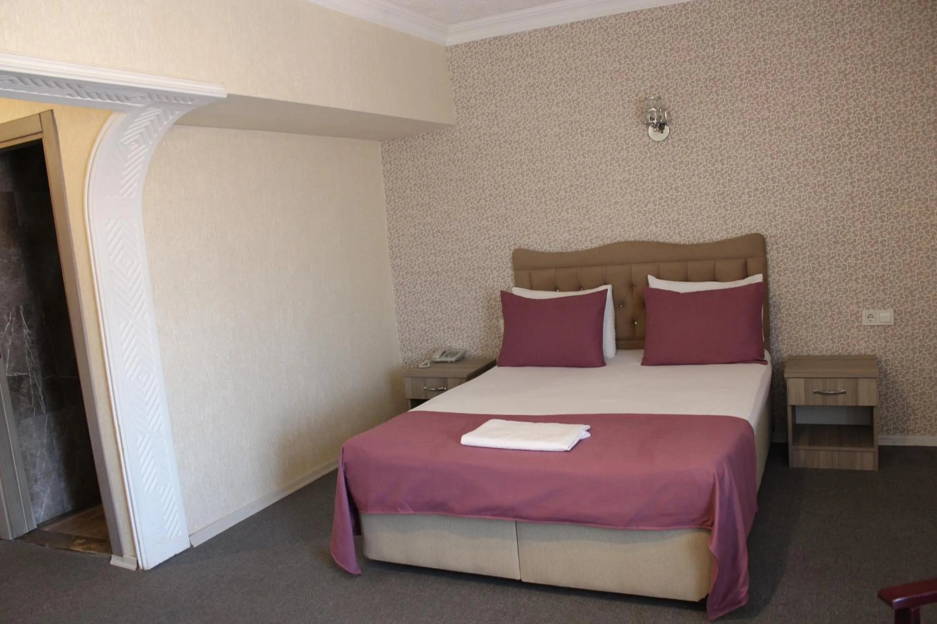 Bed in ANGRAND HOTEL