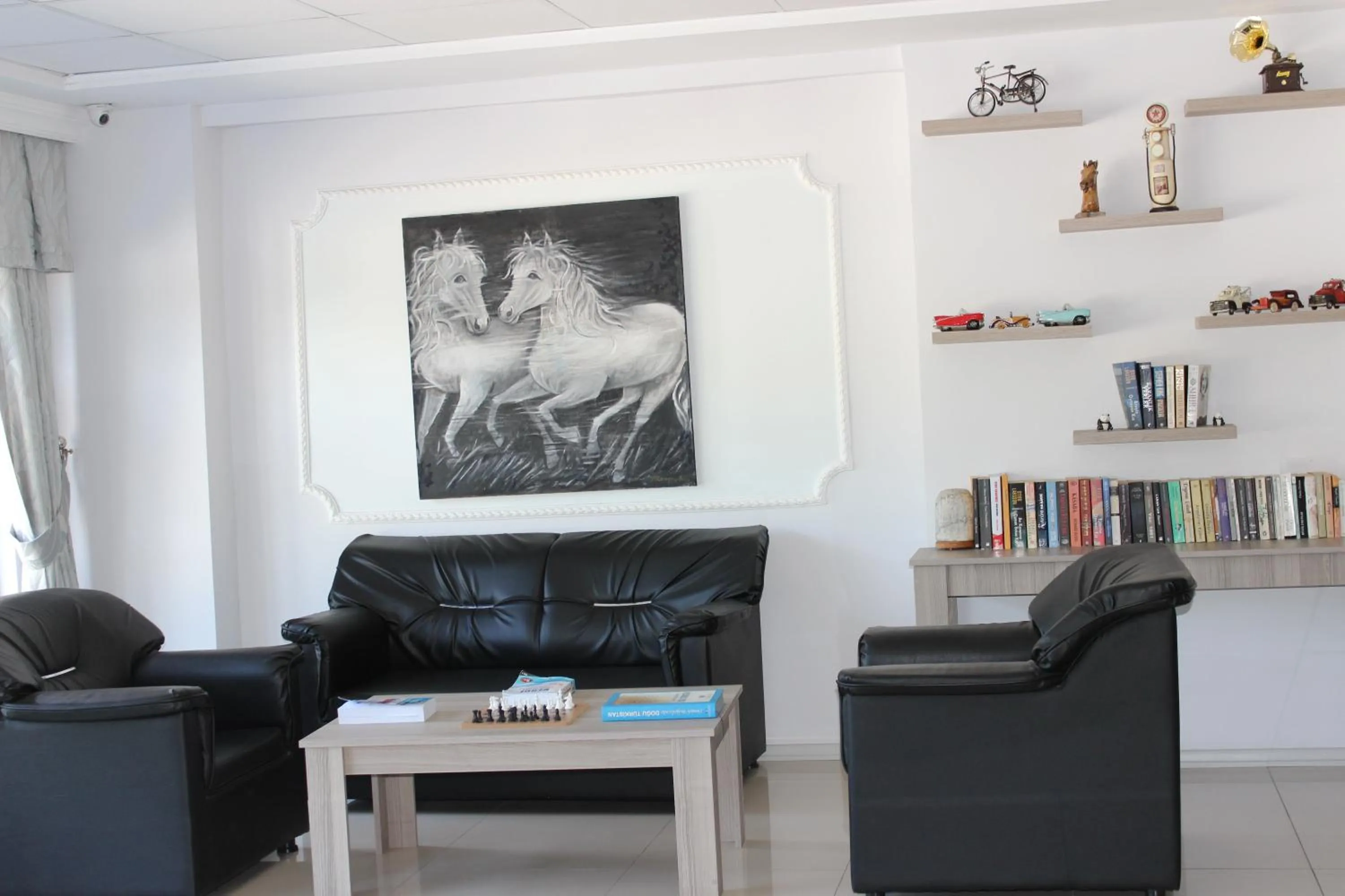 Communal lounge/ TV room in ANGRAND HOTEL