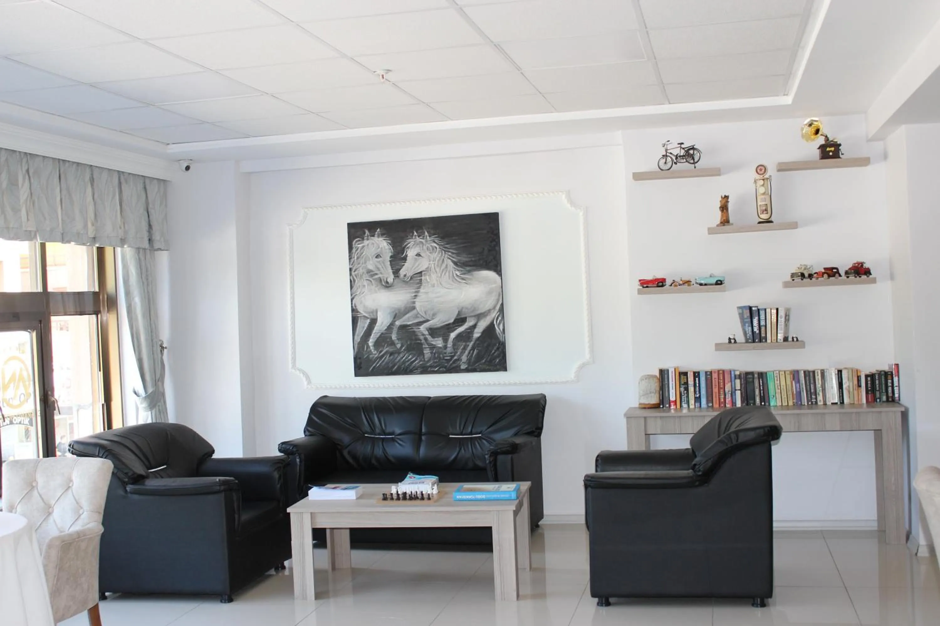 Communal lounge/ TV room in ANGRAND HOTEL