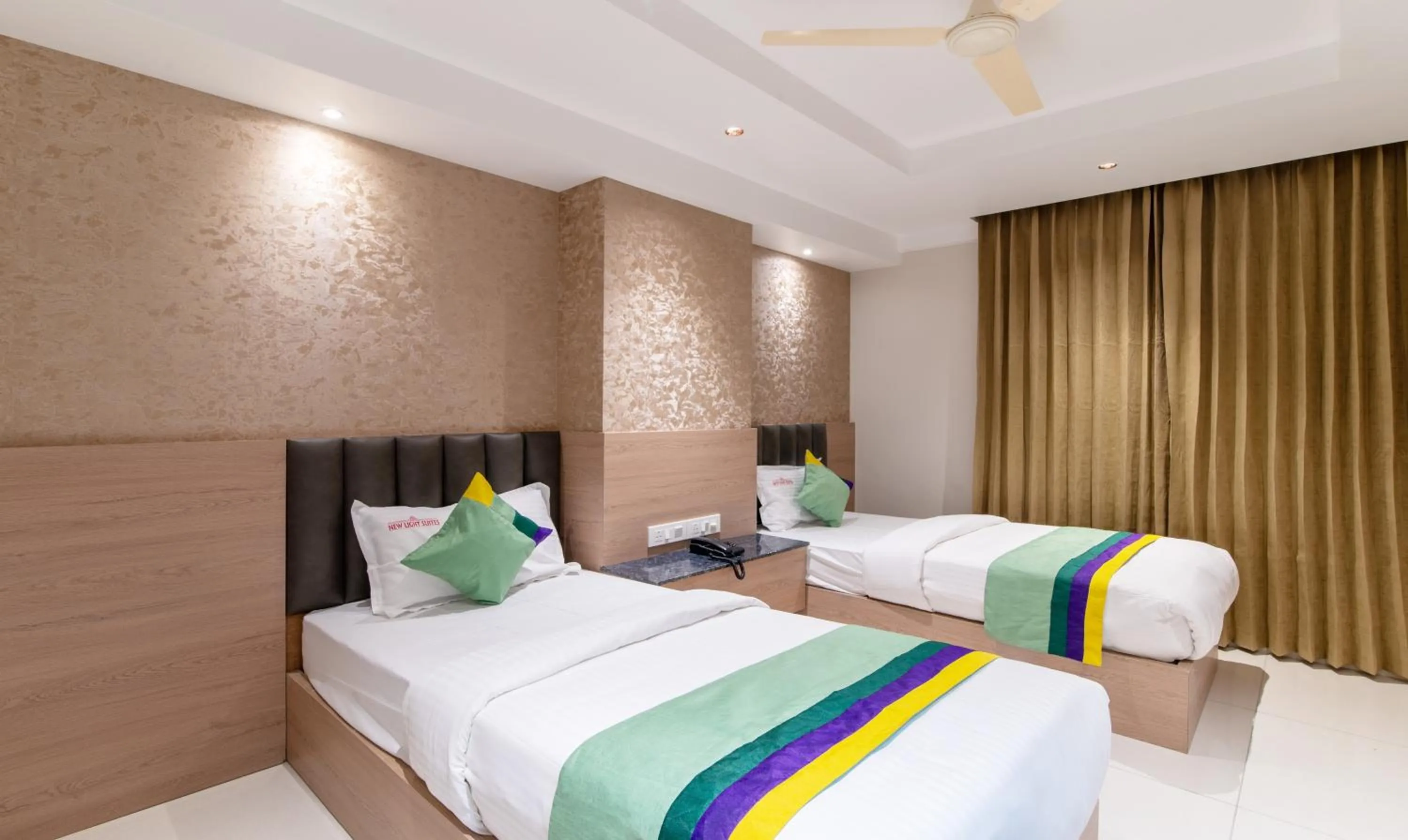 Bedroom, Bed in Treebo Premium New Light Suites