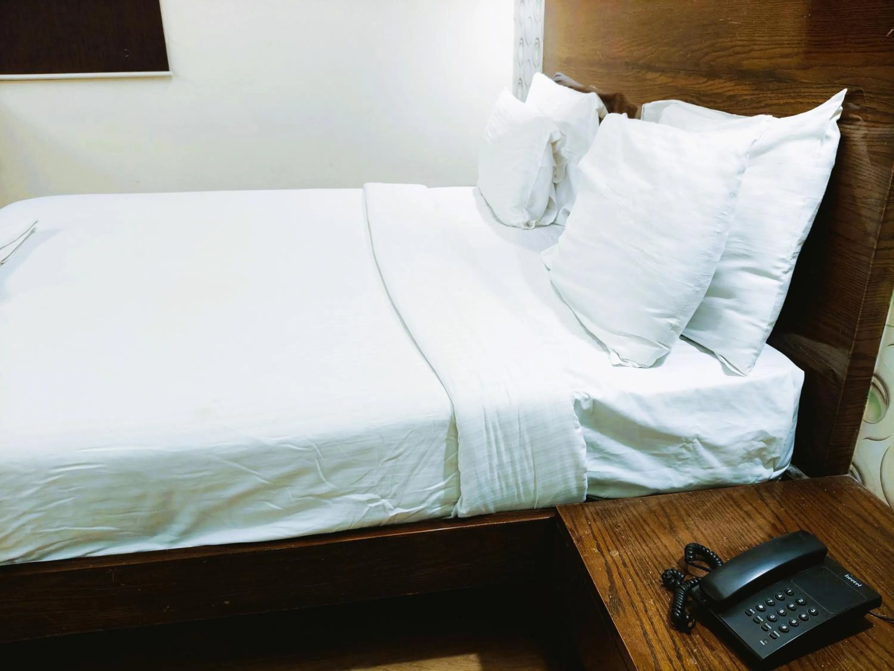 Bed in Athasri Hotel Infantry Road