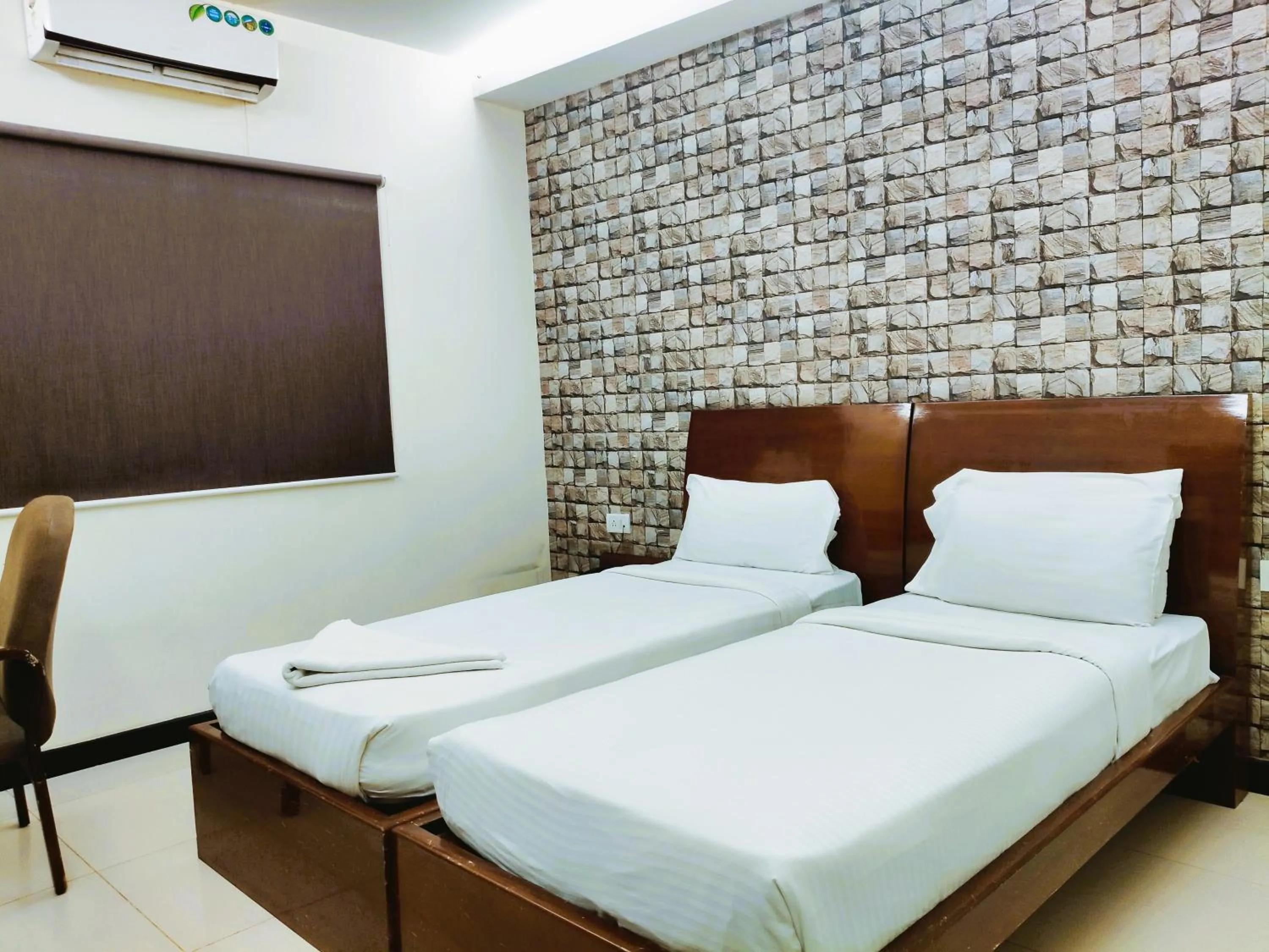 Bed in Athasri Hotel Infantry Road