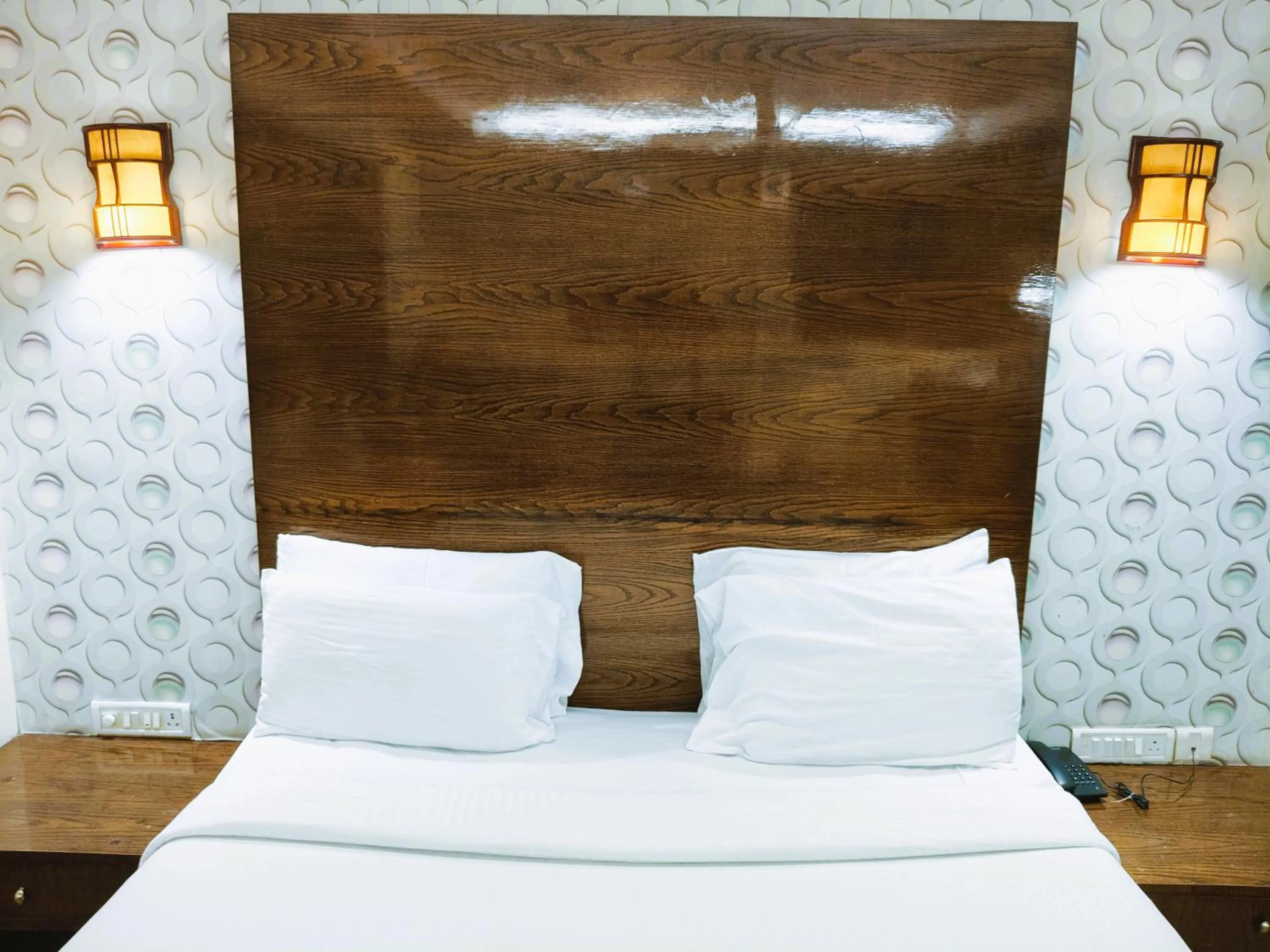 Bed in Athasri Hotel Infantry Road