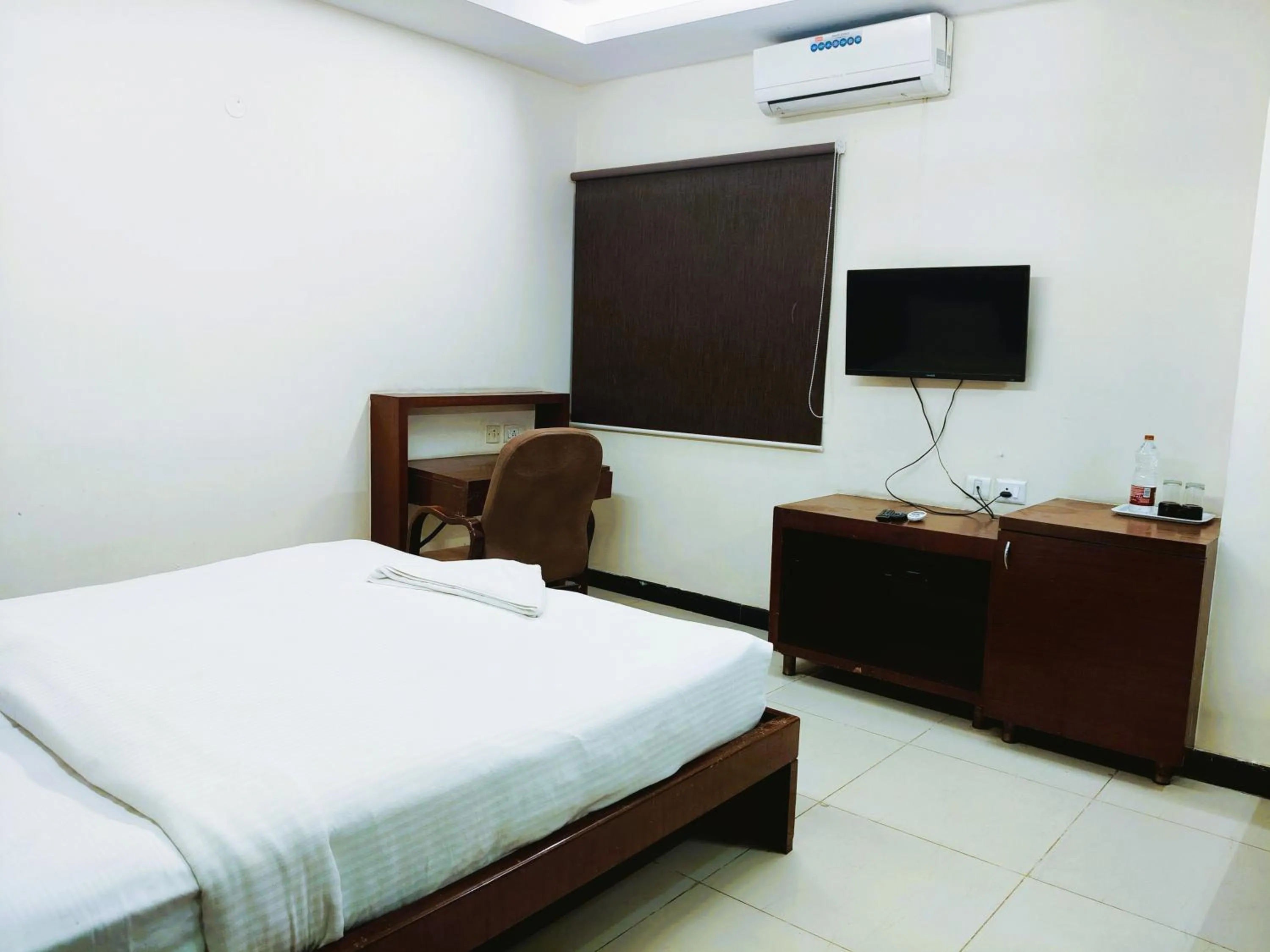 Bed in Athasri Hotel Infantry Road