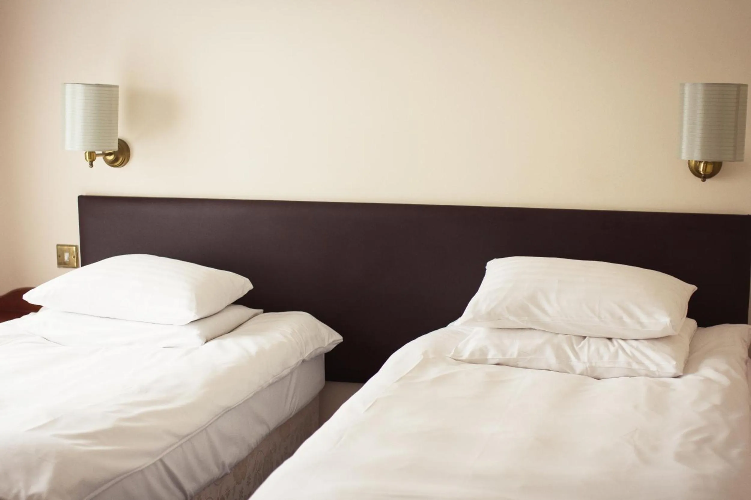 Bed in Abbey Lodge Hotel