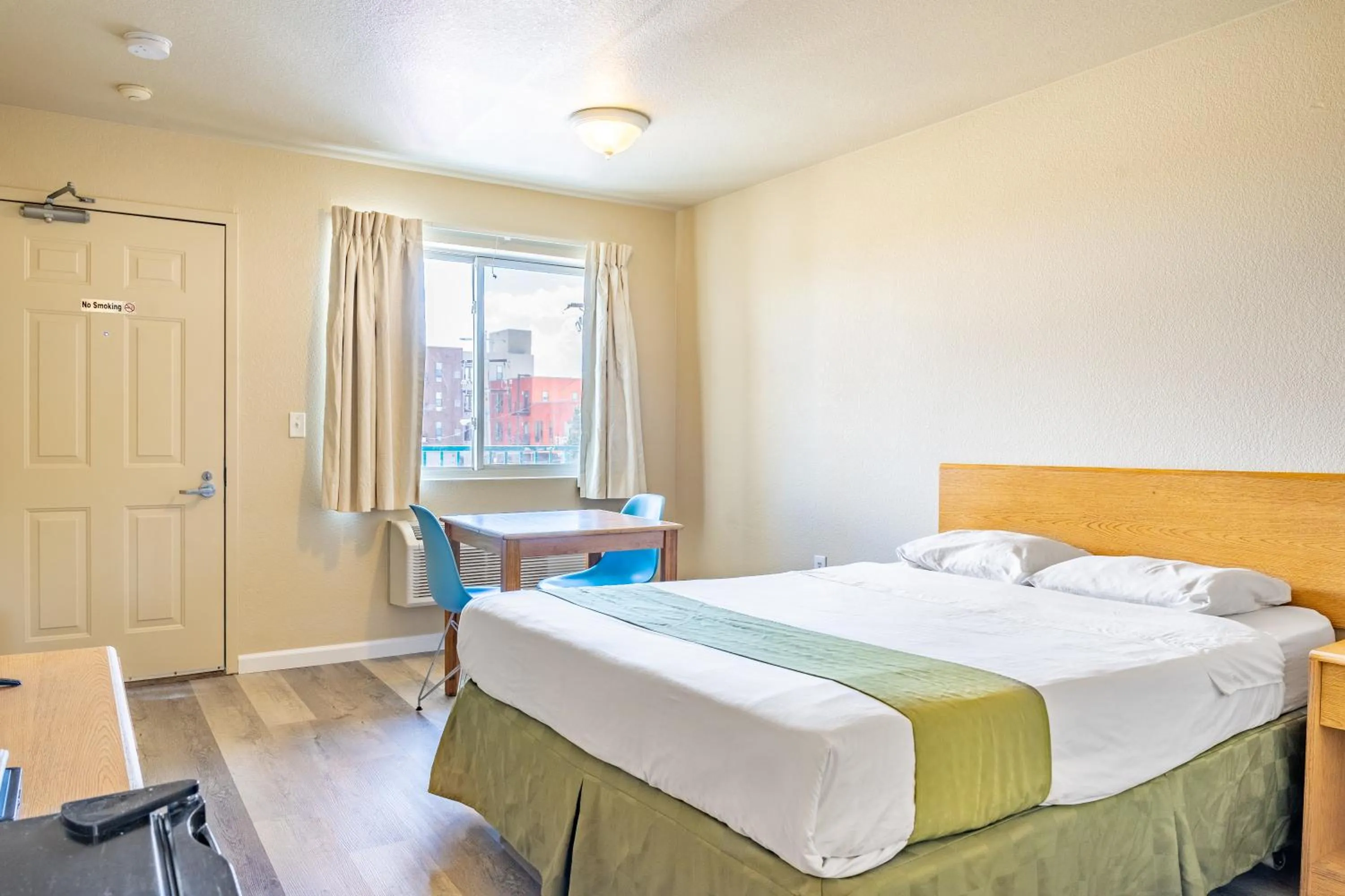 Photo of the whole room, Bed in City Inn