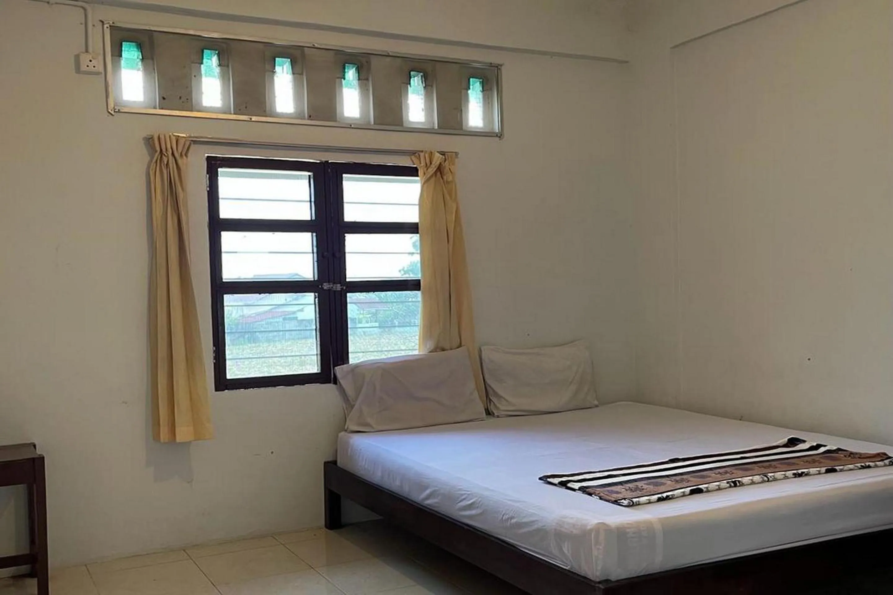 Bedroom in Hotel O Saril Riverside HomestayNearLapangan Musara Alun
