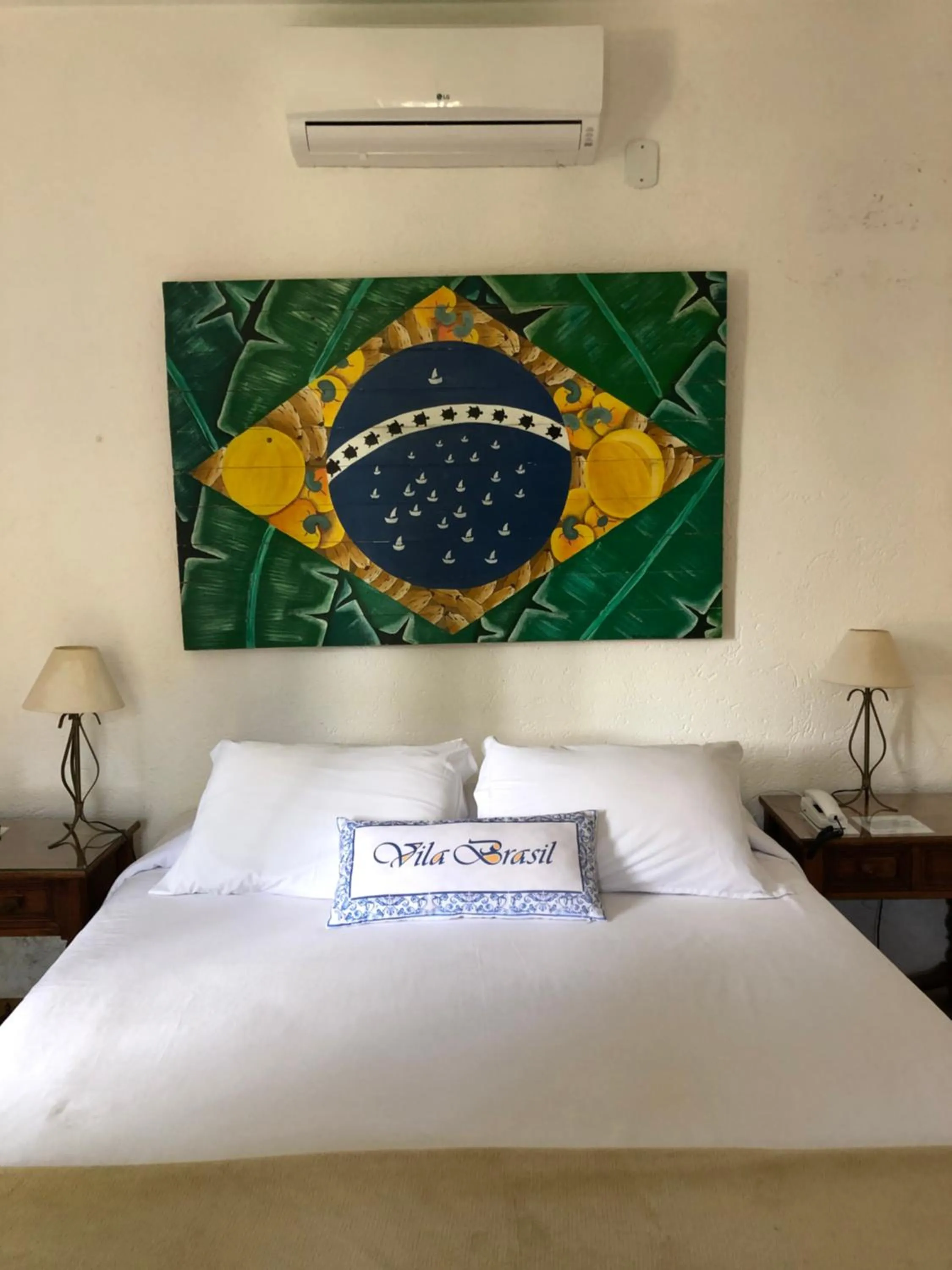 Bed in Pousada Vila Brasil
