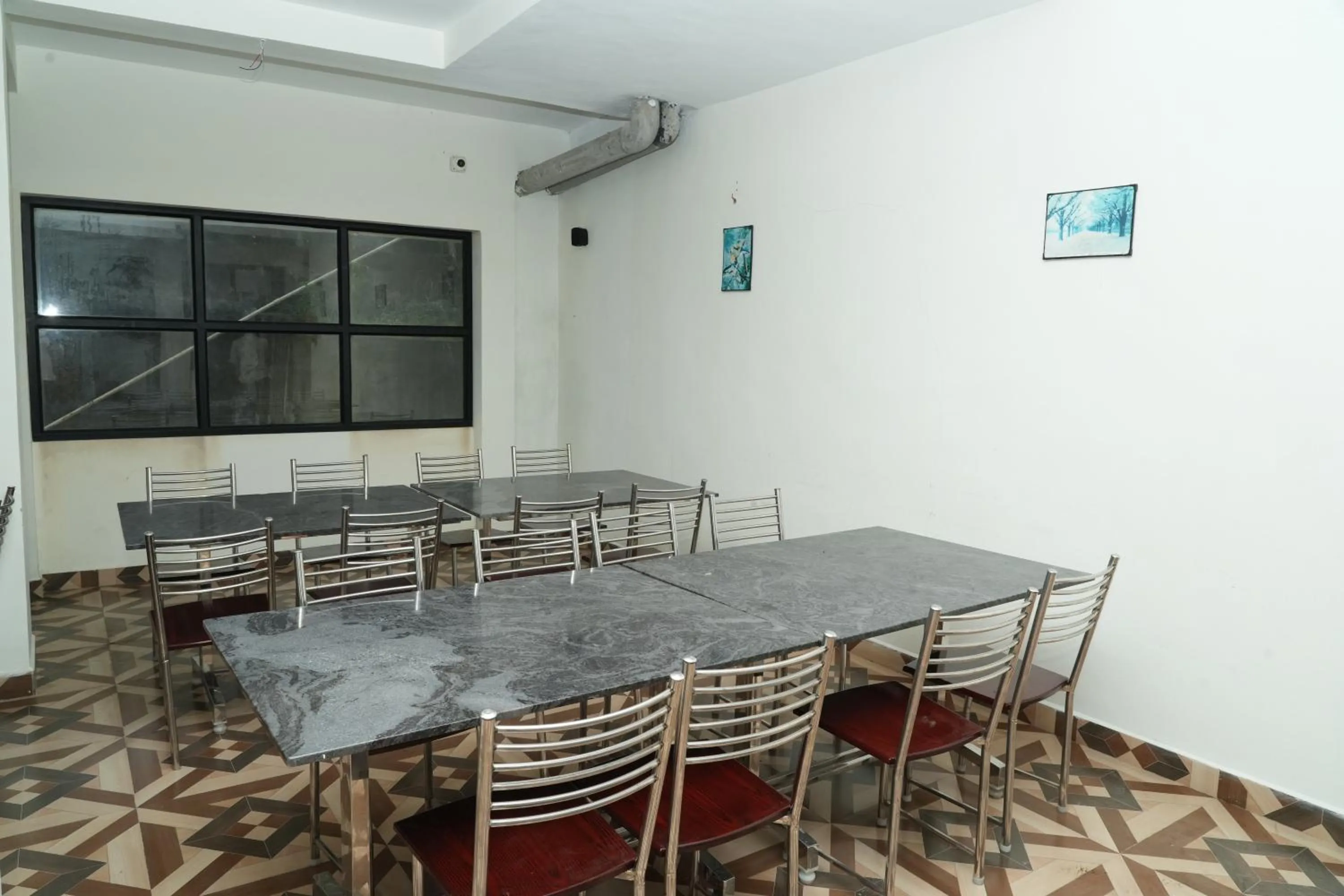 Dining area in Vetrivel International by Brown Tree Resorts