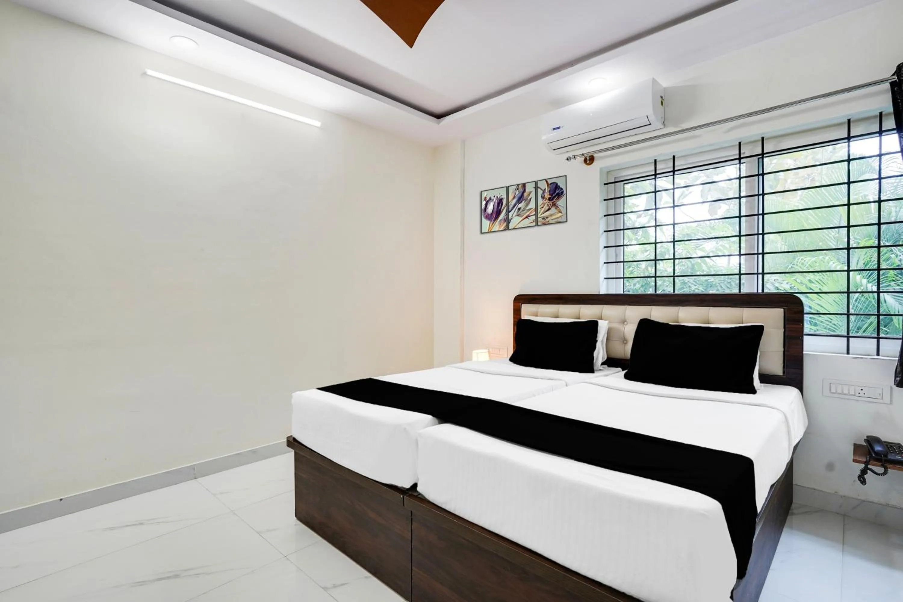Bedroom in Super Townhouse Bidadi Formerly Royal Garuda
