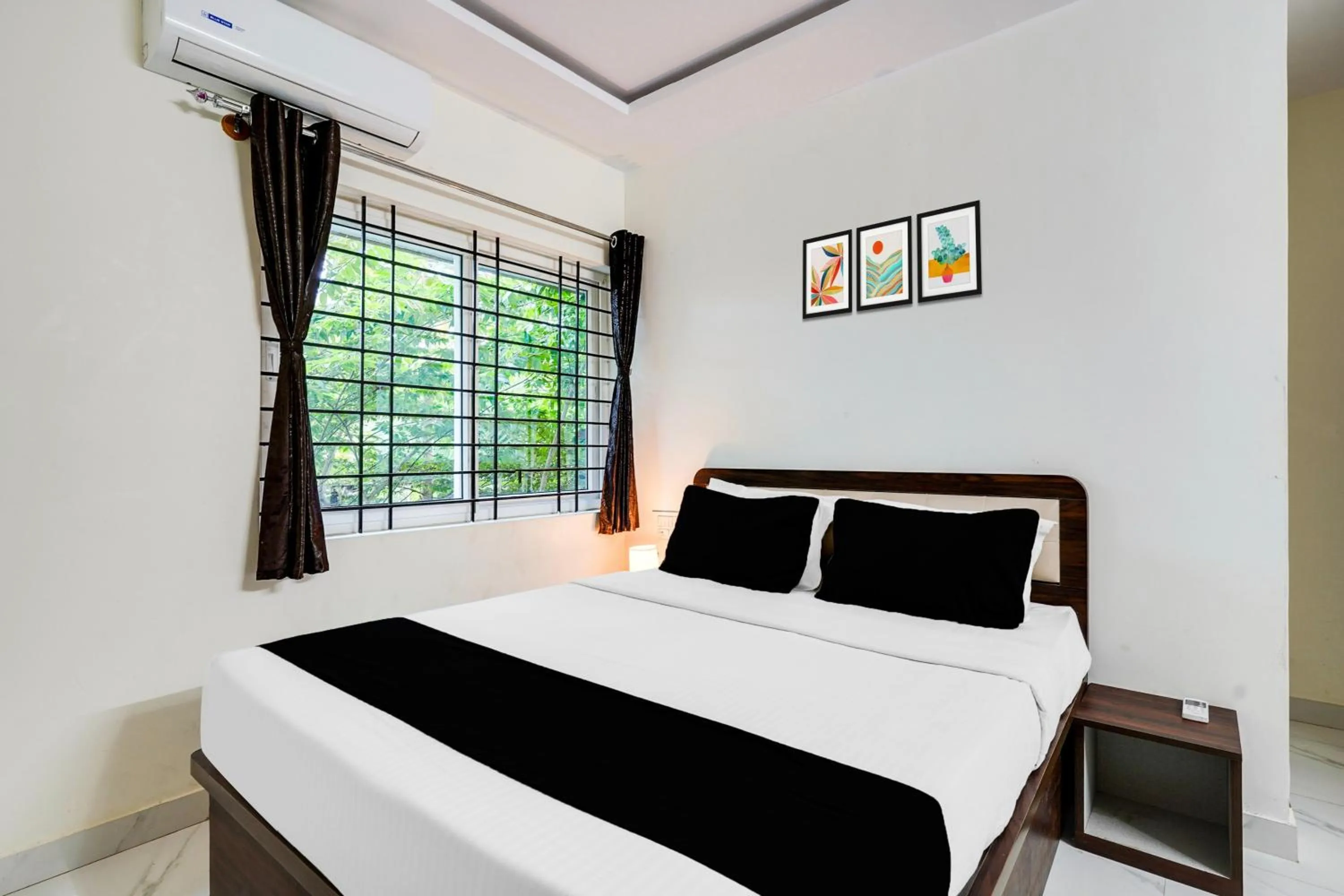 Bedroom in Super Townhouse Bidadi Formerly Royal Garuda