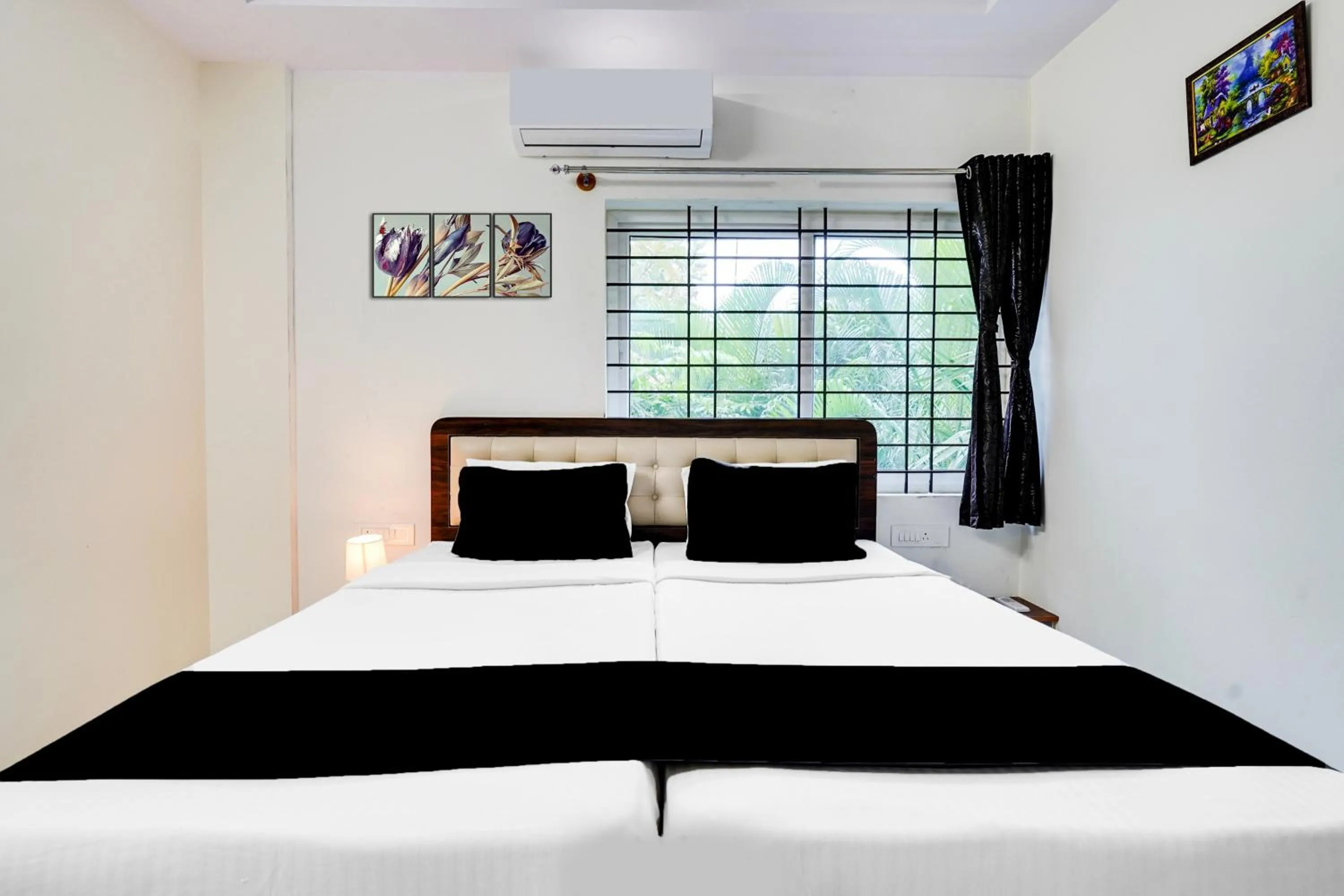 Bedroom in Super Townhouse Bidadi Formerly Royal Garuda