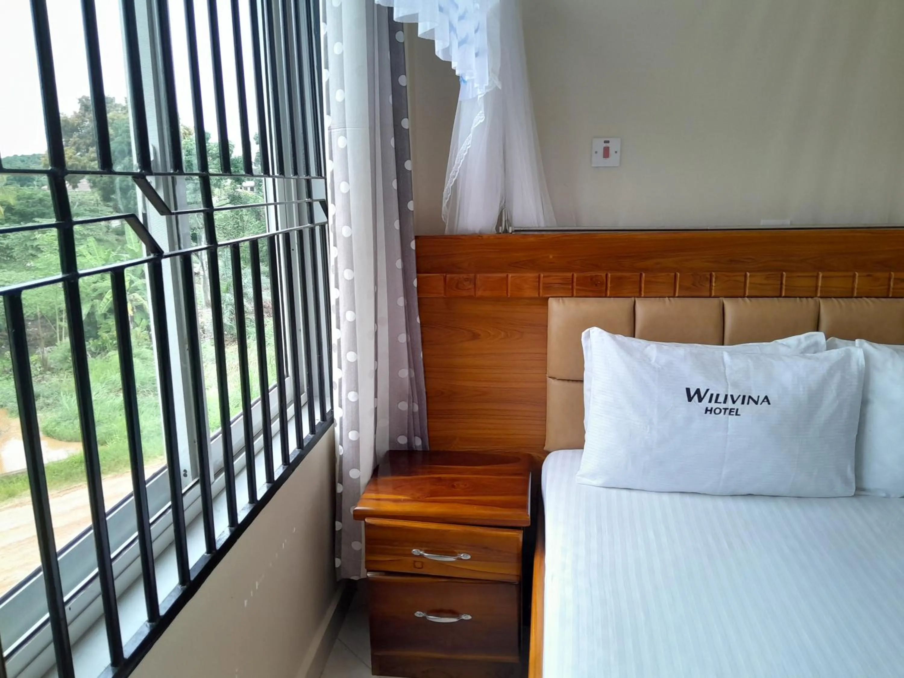 Bed in WILIVINA HOTEL