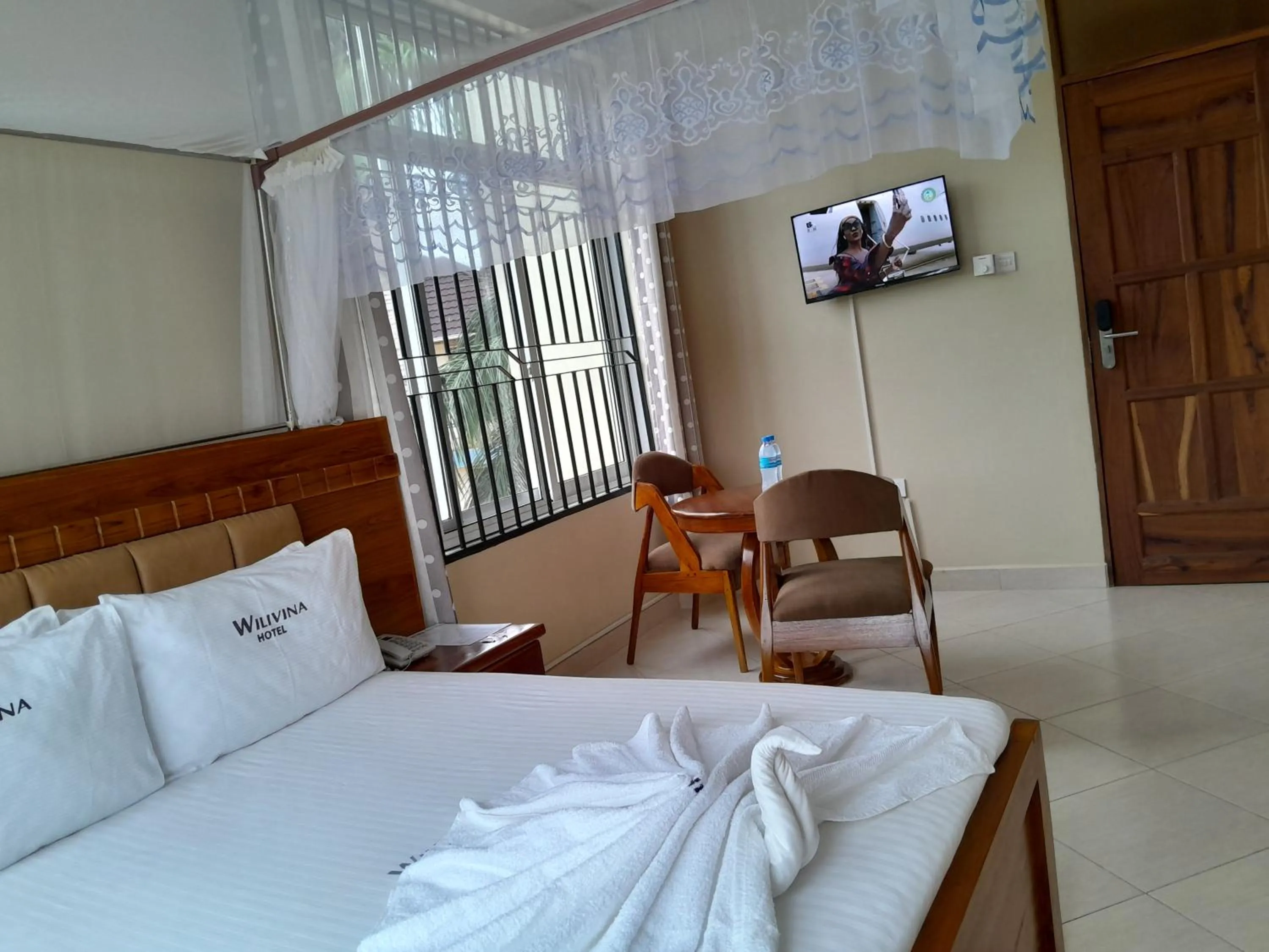 Bed in WILIVINA HOTEL