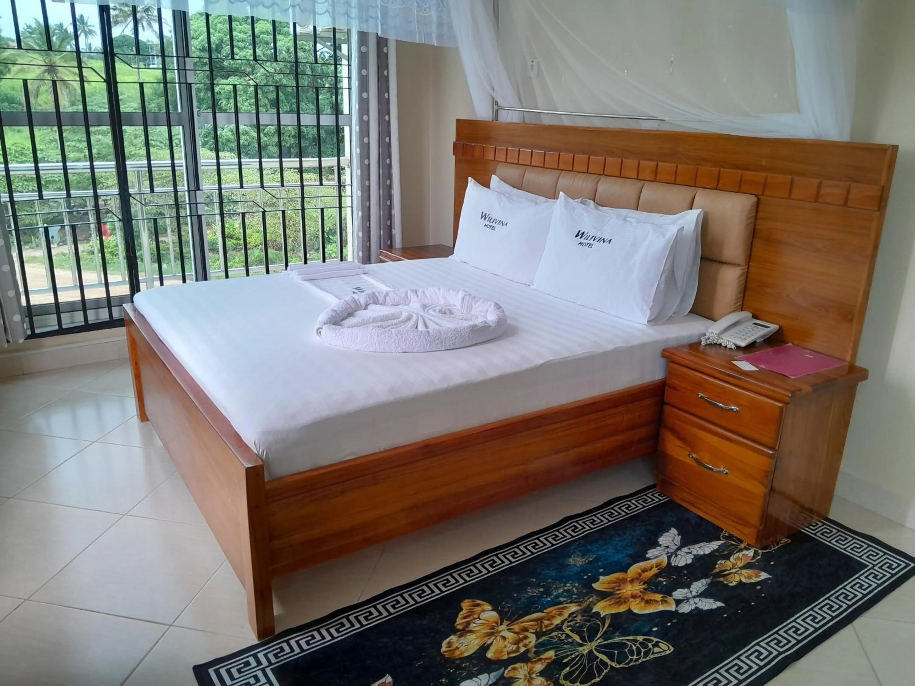 Bed in WILIVINA HOTEL