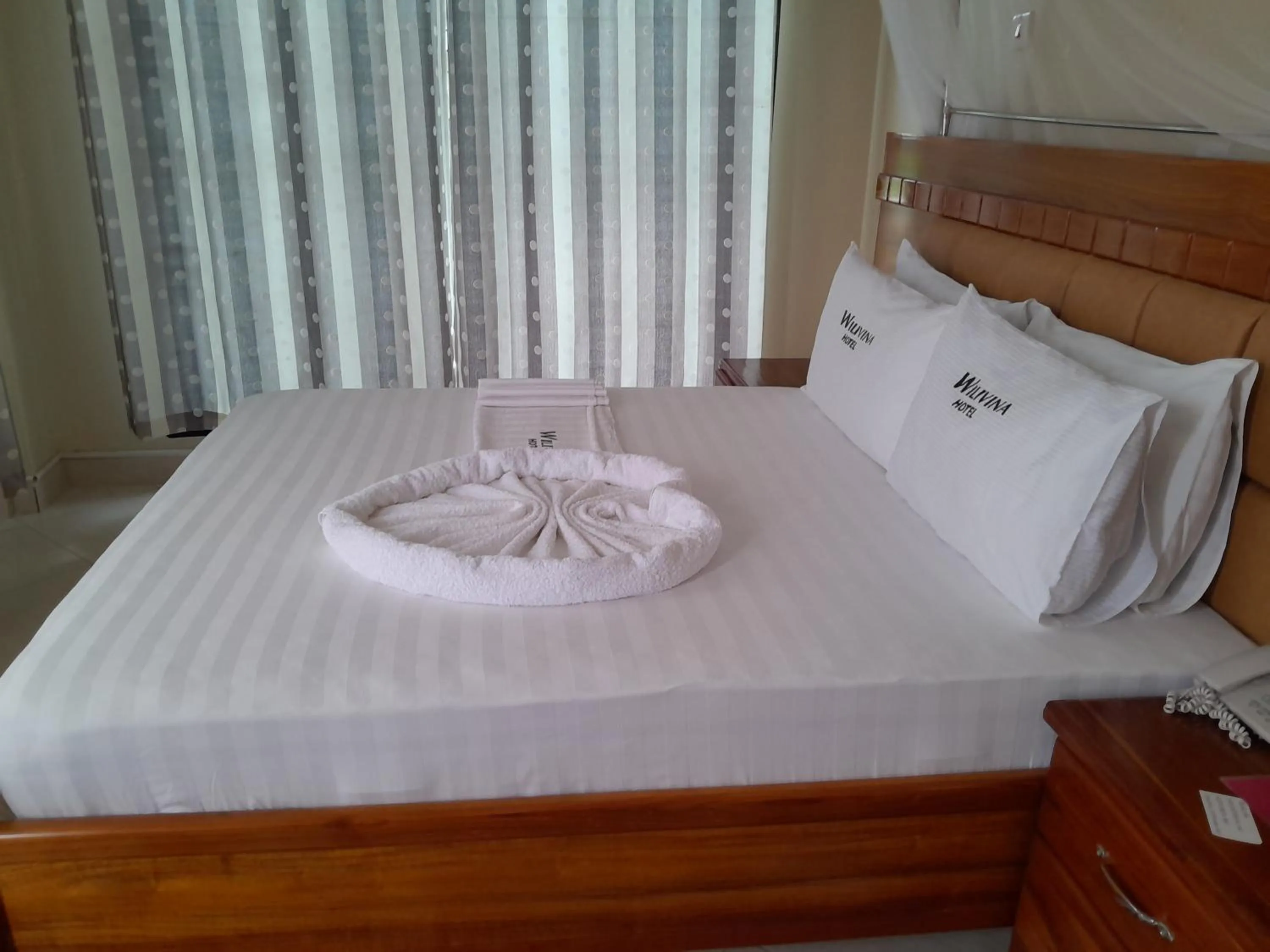Bed in WILIVINA HOTEL