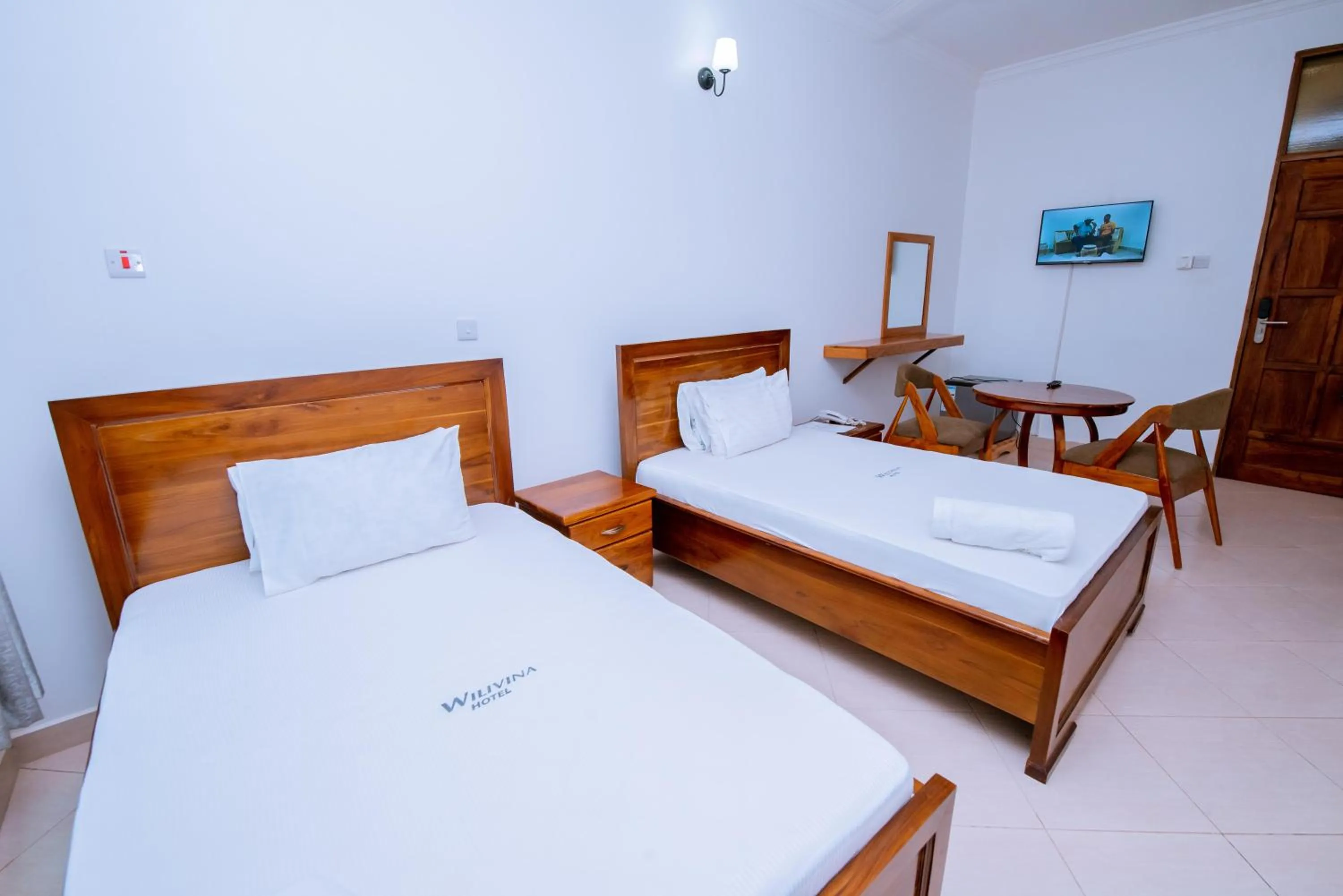 Bed in WILIVINA HOTEL