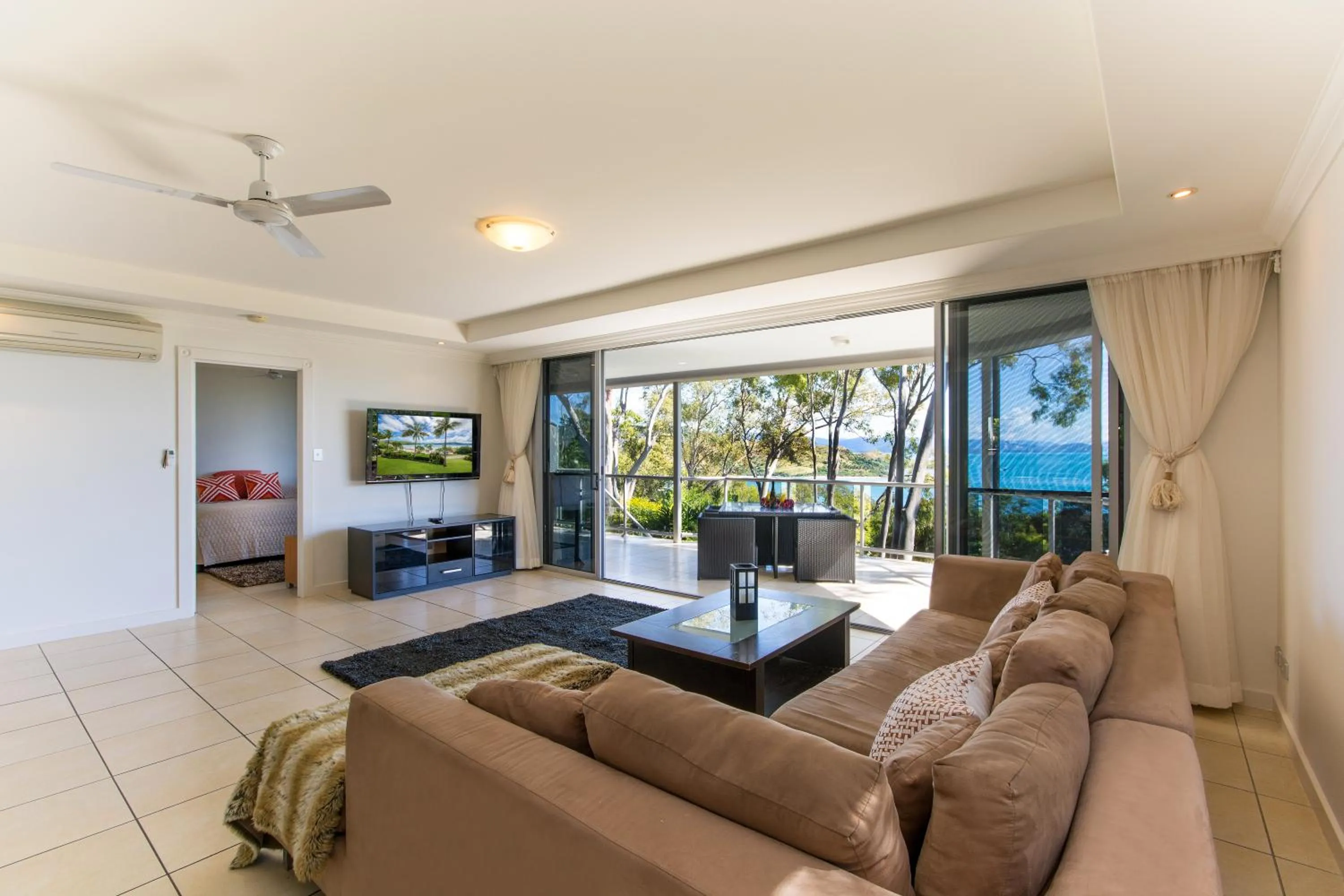 Living room in Blue Water Views on Hamilton Island by HIHA