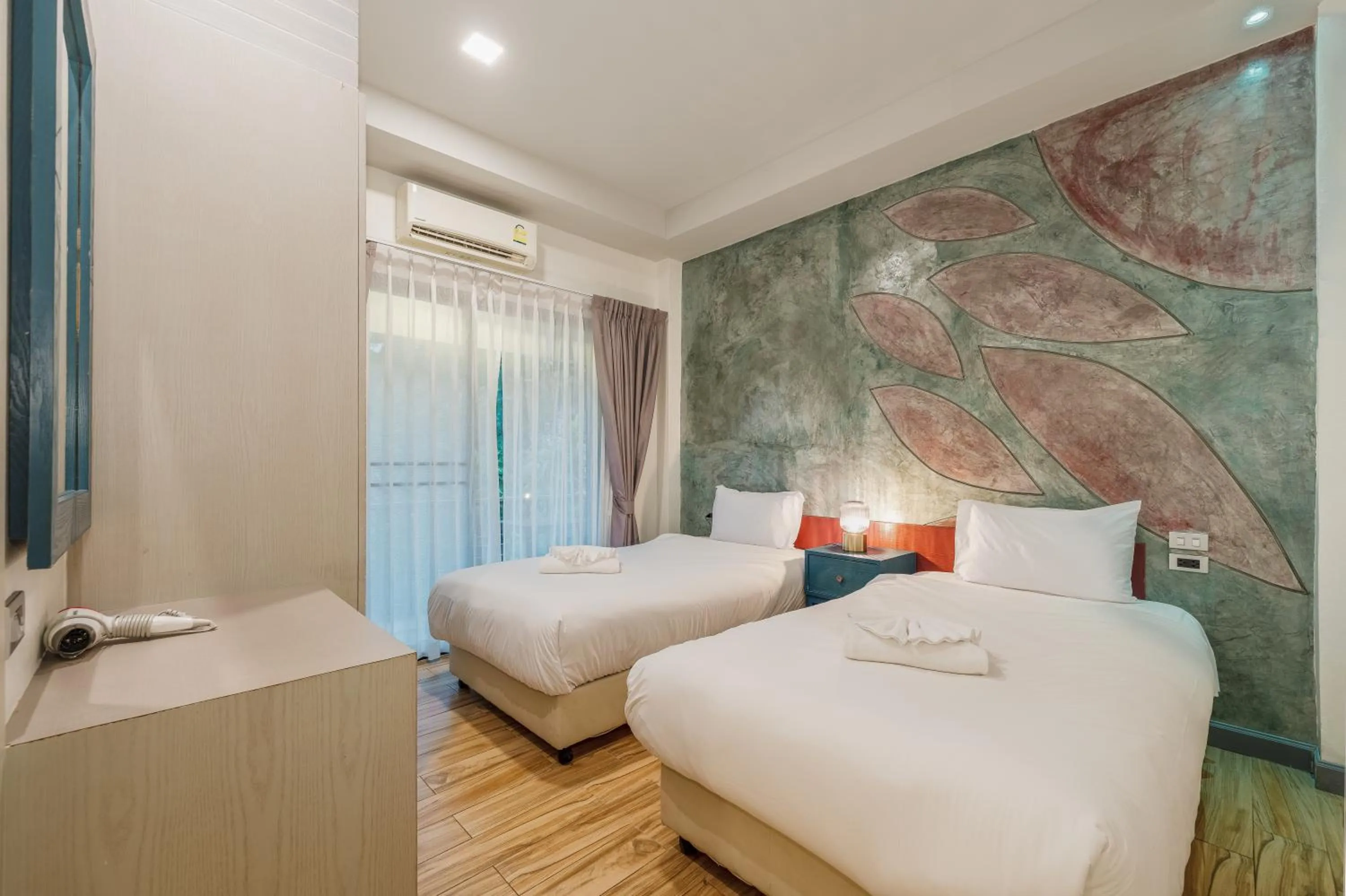 Bed in Coco Retreat Phuket Resort and Spa - SHA Plus