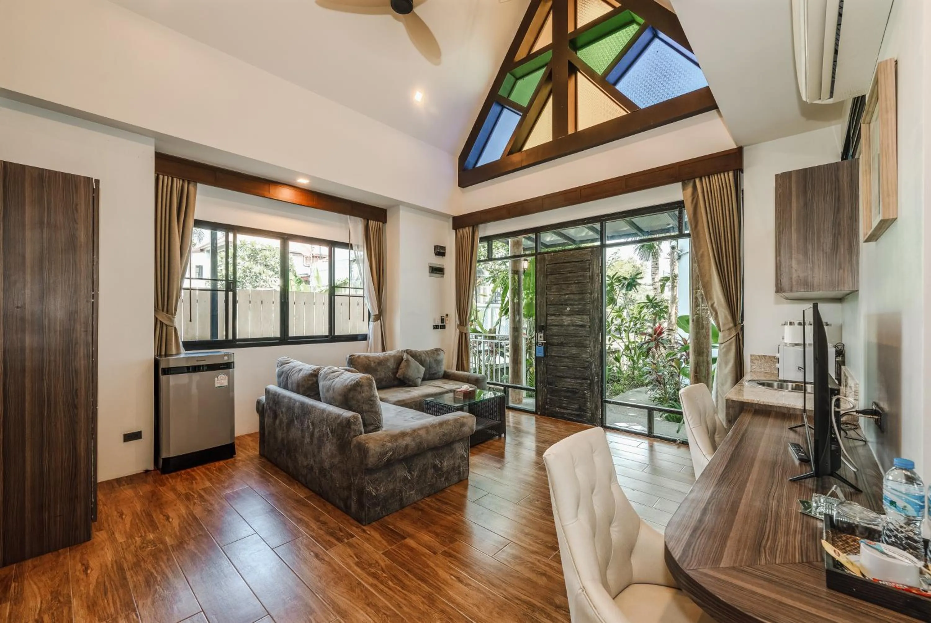 Living room in Coco Retreat Phuket Resort and Spa - SHA Plus