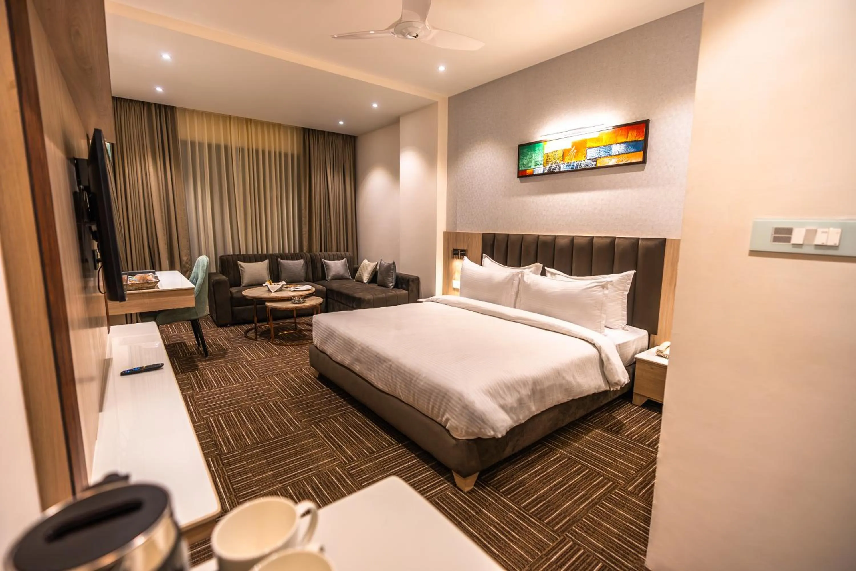 Seating area, Bed in Clarks inn Express Ayodhya