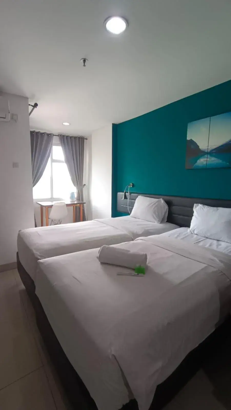 Standard Twin Room in Izi Cozi Jababeka Enviro Powered by Archipelago Standard Twin Room in Izi Cozi Jababeka Enviro Powered by Archipelago