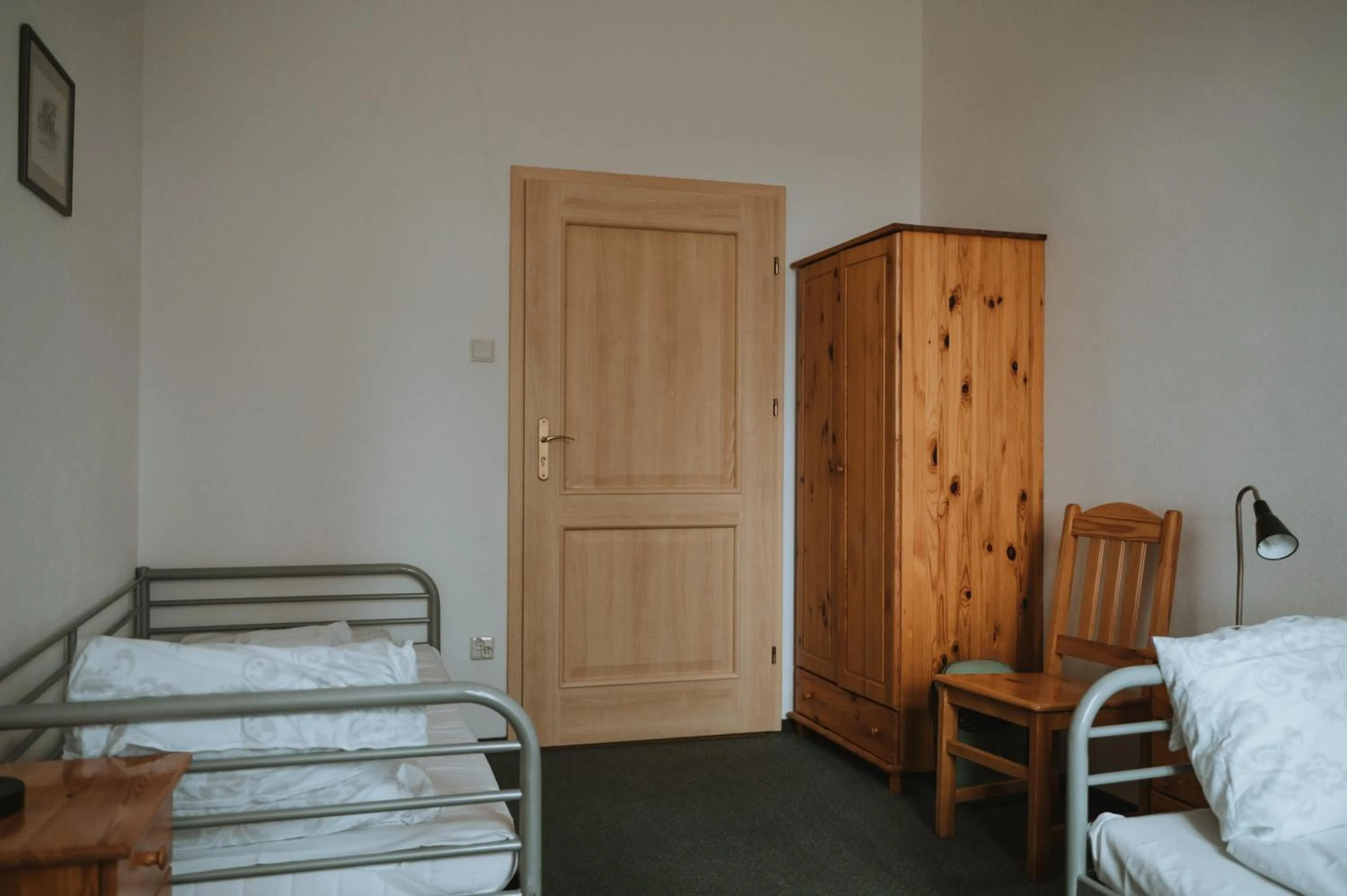 Bed in Pokoje Gościnne Domu Pielgrzyma w Supraślu