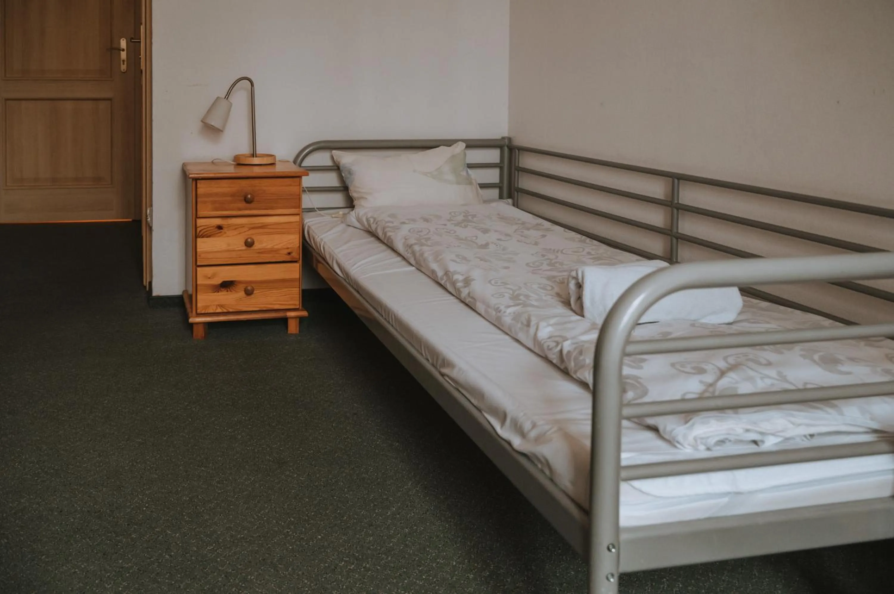 Bed in Pokoje Gościnne Domu Pielgrzyma w Supraślu