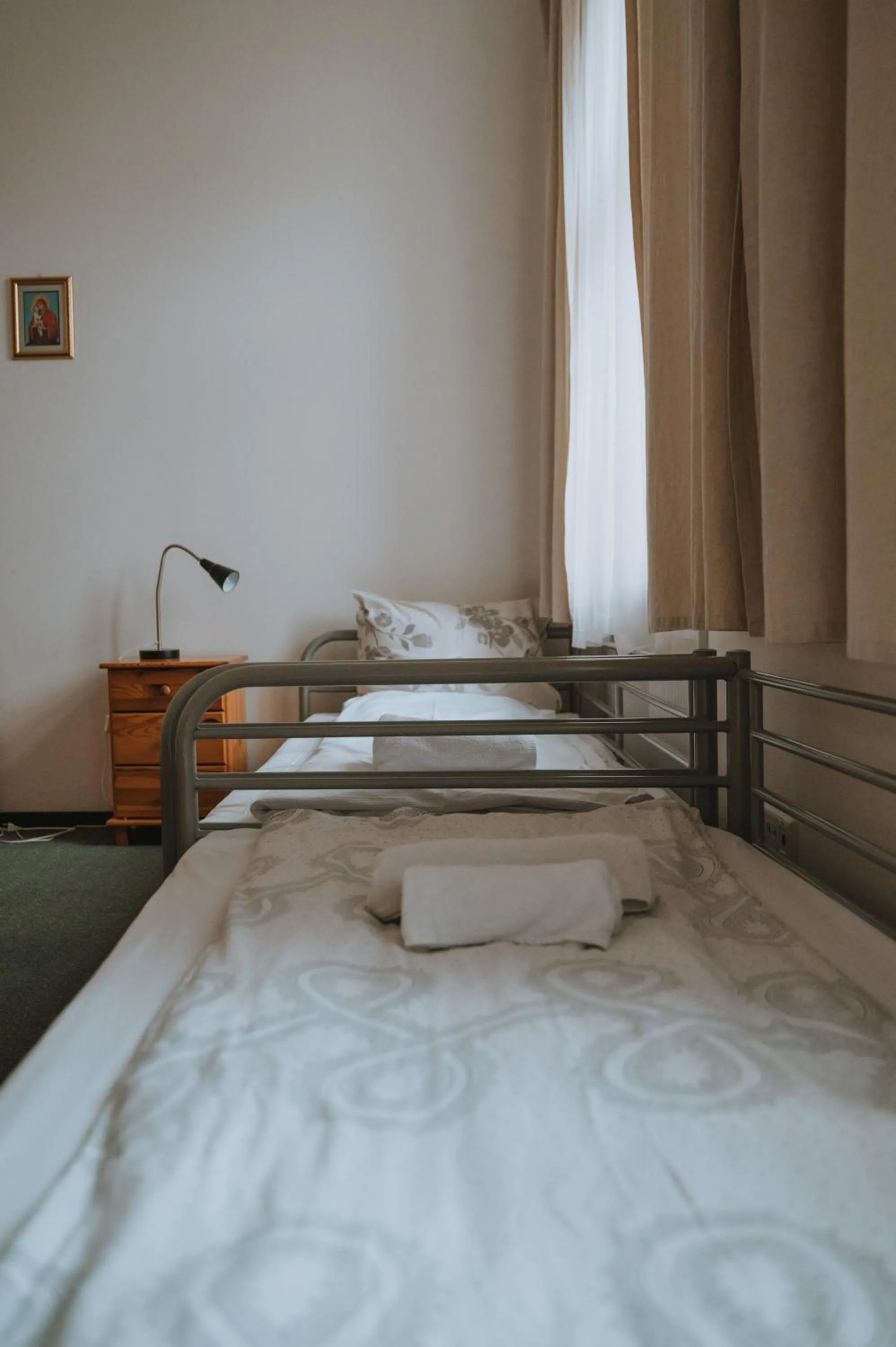 Bed in Pokoje Gościnne Domu Pielgrzyma w Supraślu