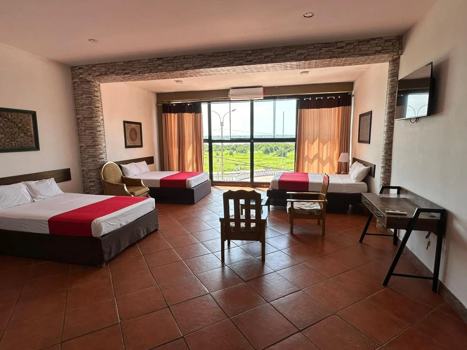 Photo of the whole room, Bed in La Posada del Cauchero Hotel & Suites