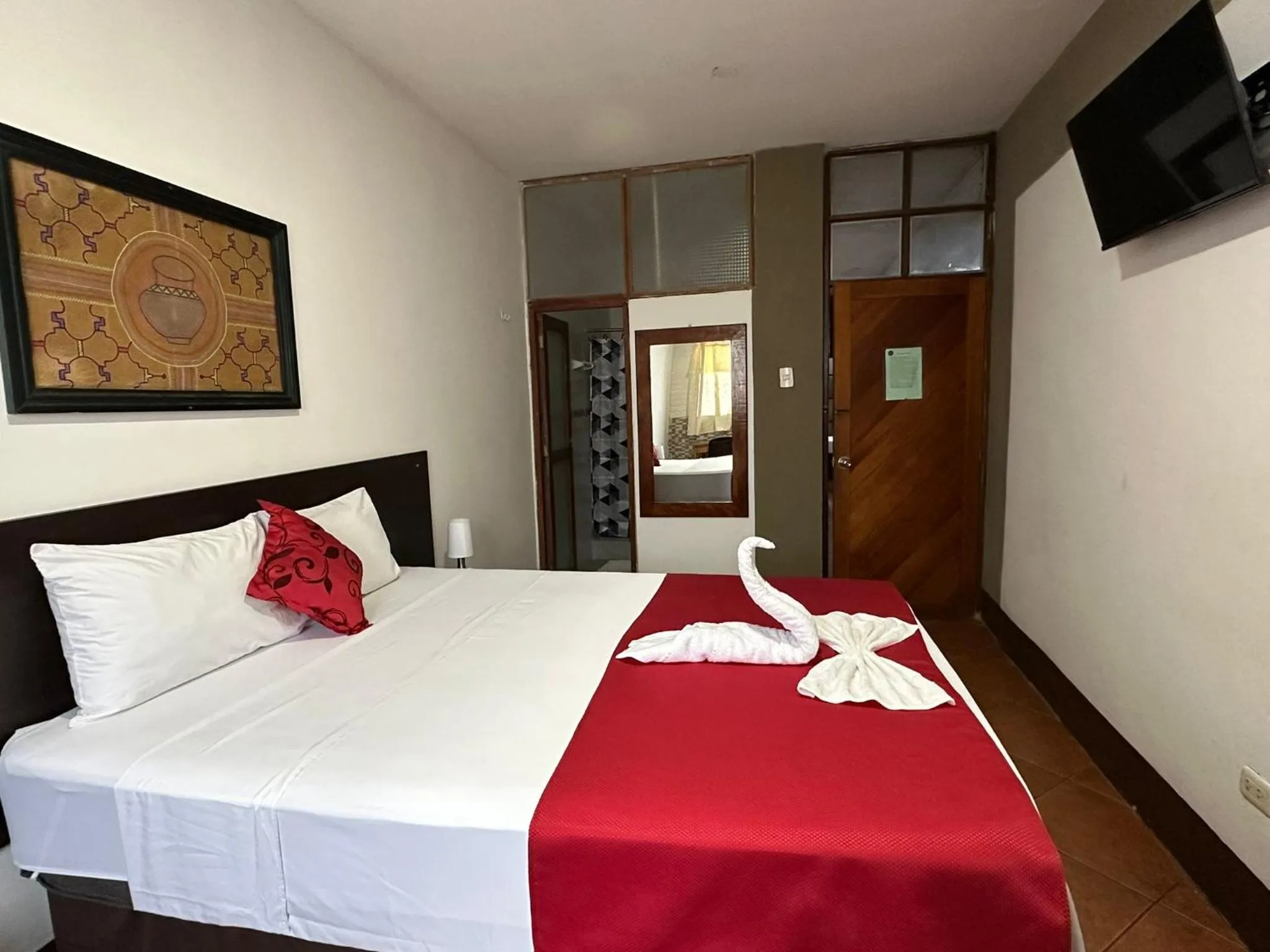 Photo of the whole room, Bed in La Posada del Cauchero Hotel & Suites