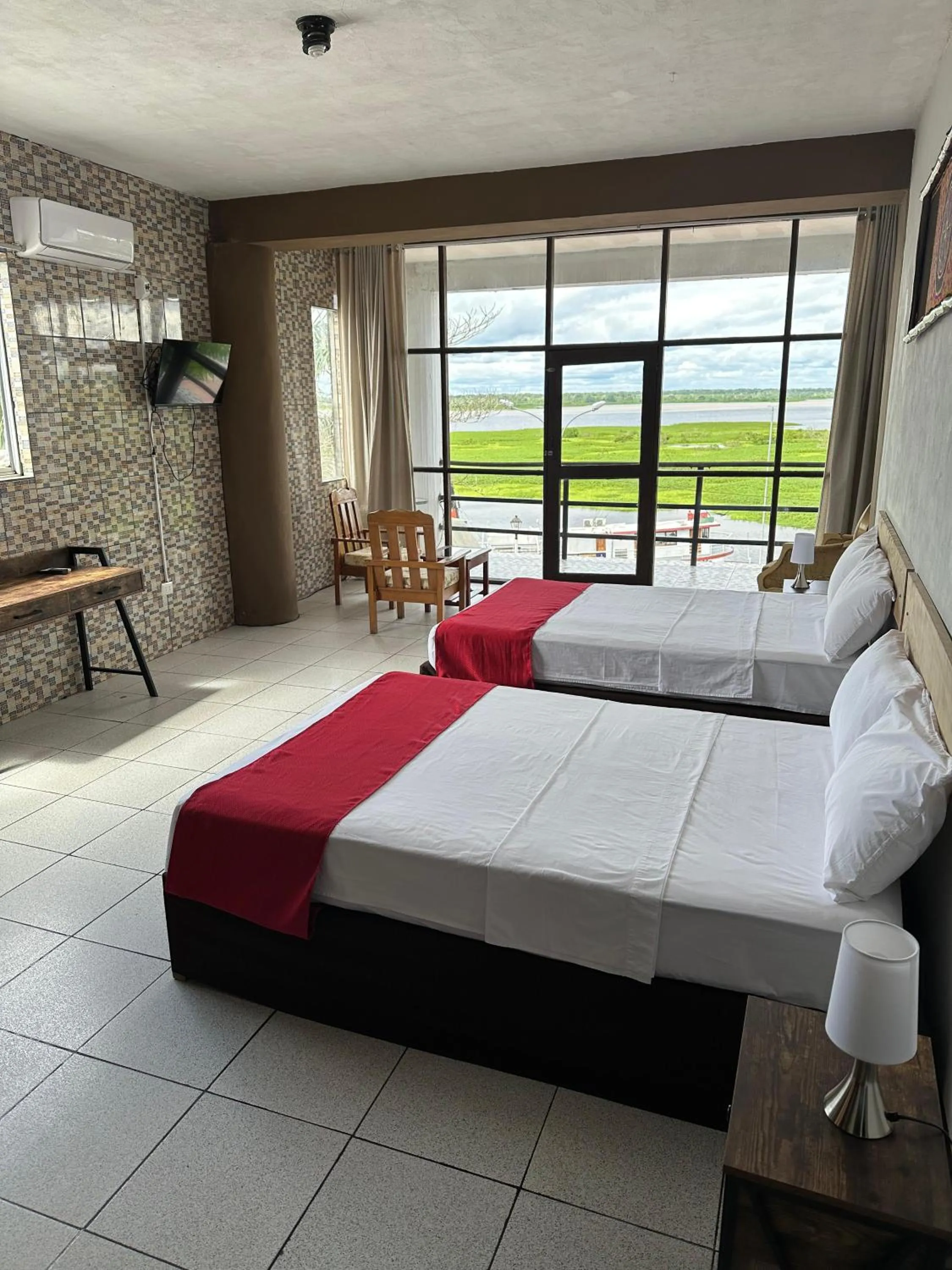 Photo of the whole room, Bed in La Posada del Cauchero Hotel & Suites