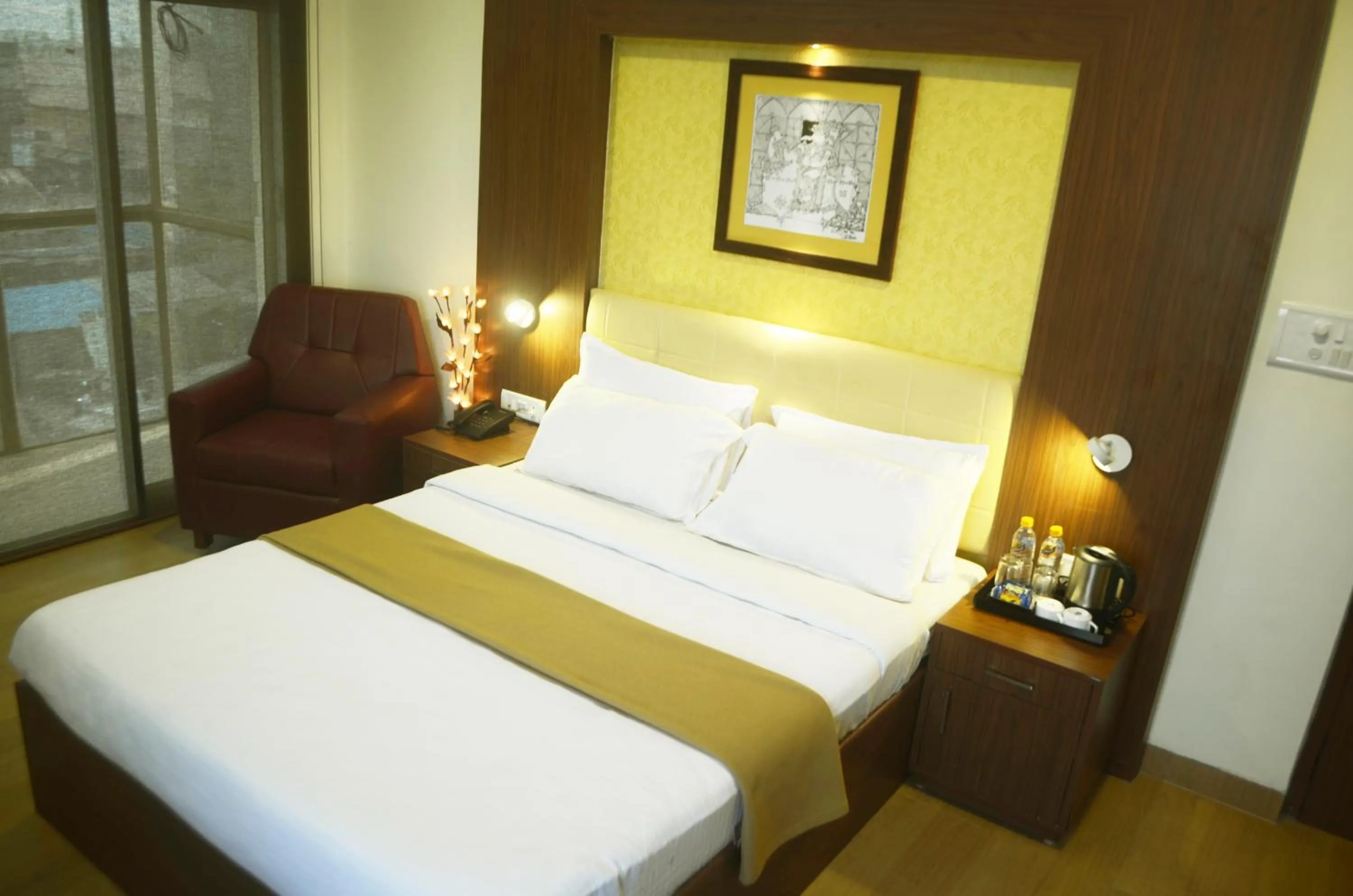 Bed in Hotel Arunachala