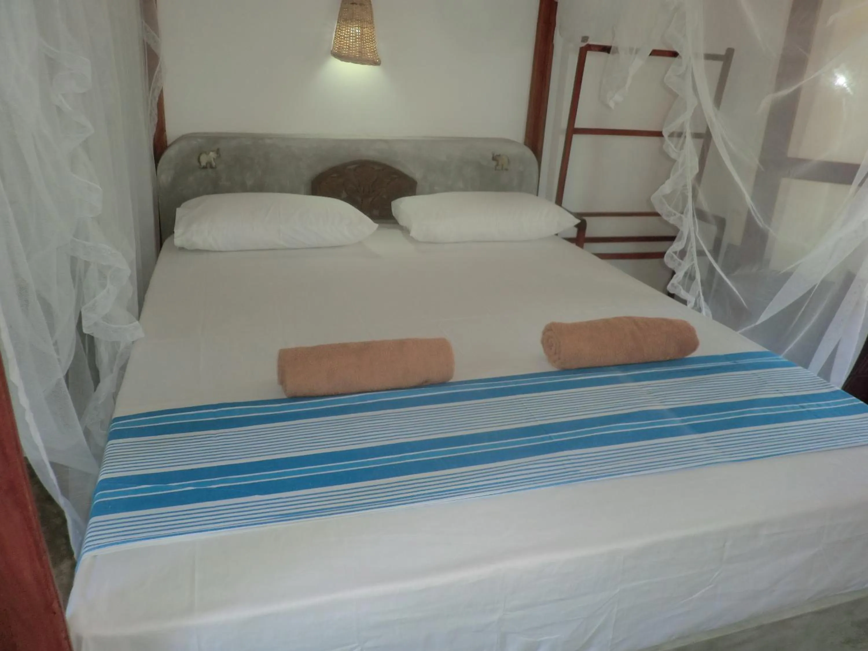 Bed in Peacock Wings Guest