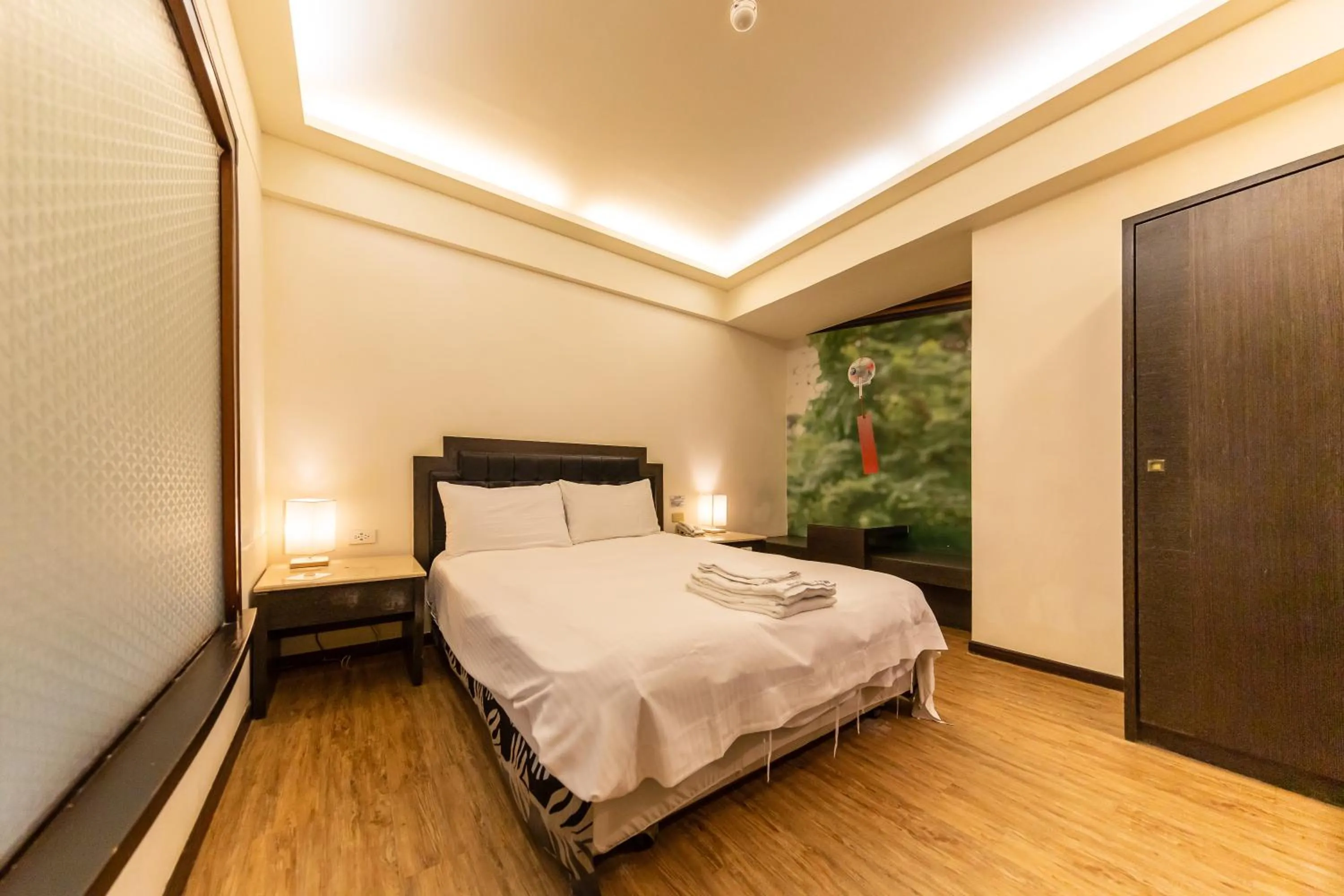 Bed in I HI Sanduo Travel Hotel