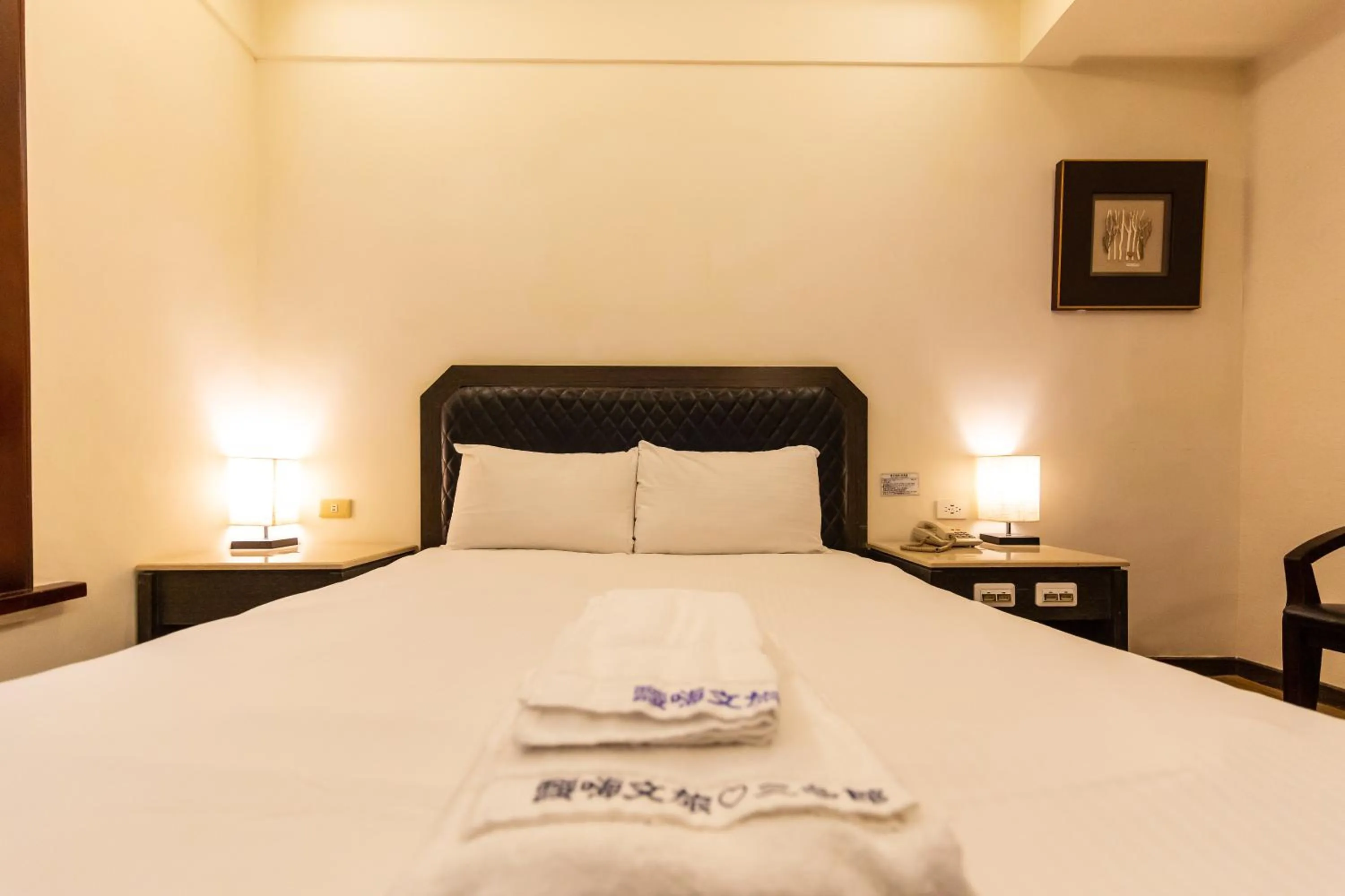 Bed in I HI Sanduo Travel Hotel