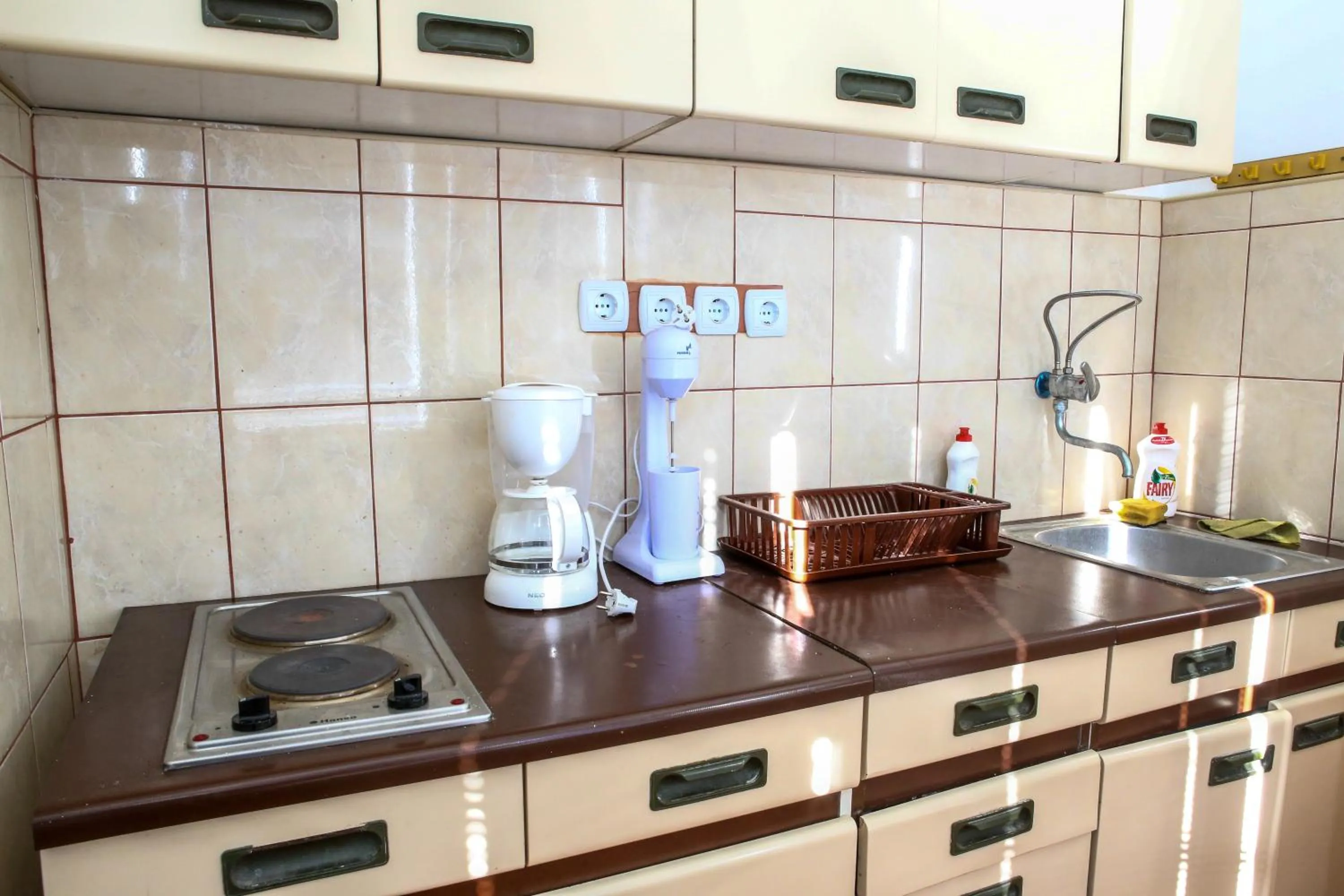 Kitchen or kitchenette in The Comfy Hostel