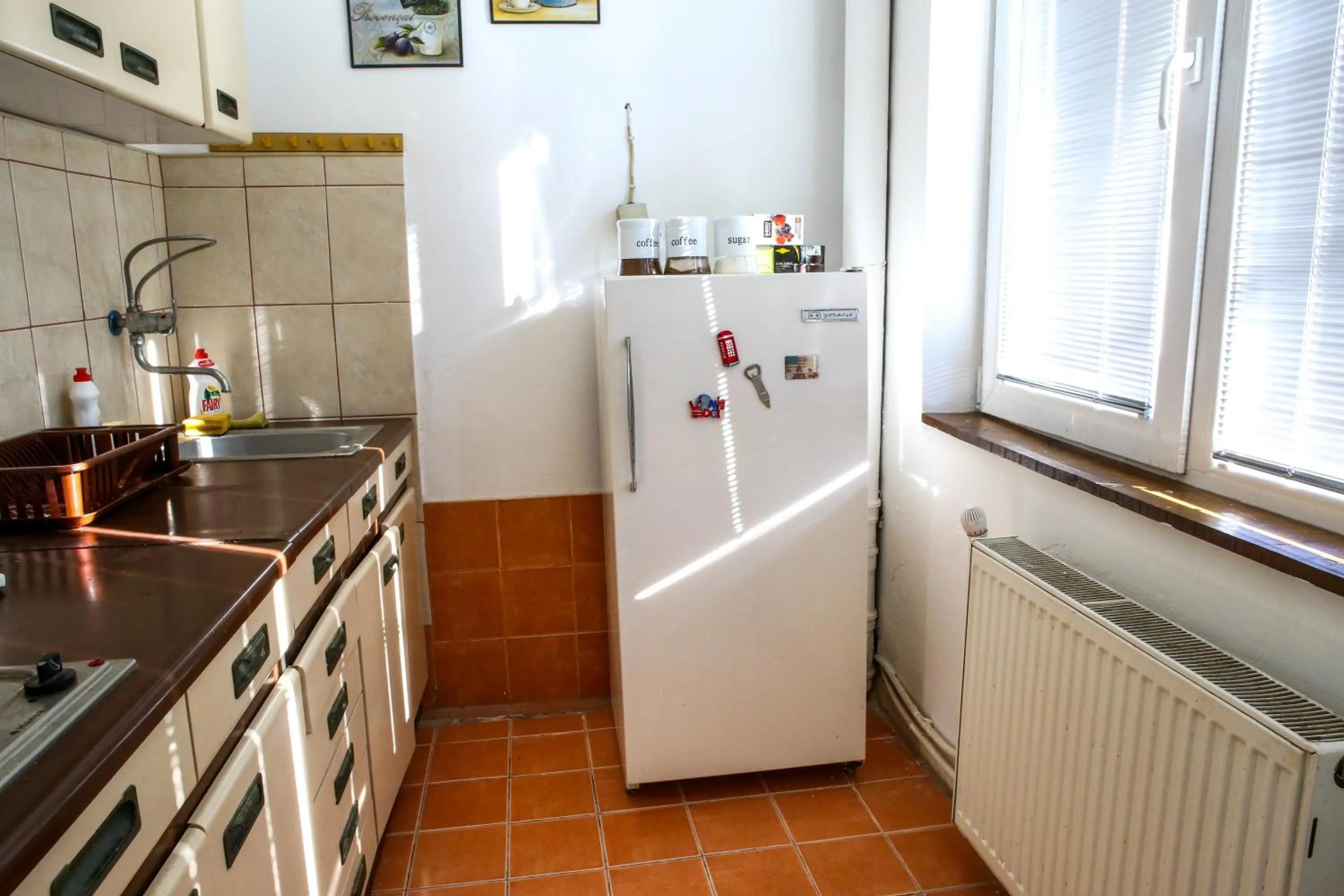 Kitchen or kitchenette in The Comfy Hostel