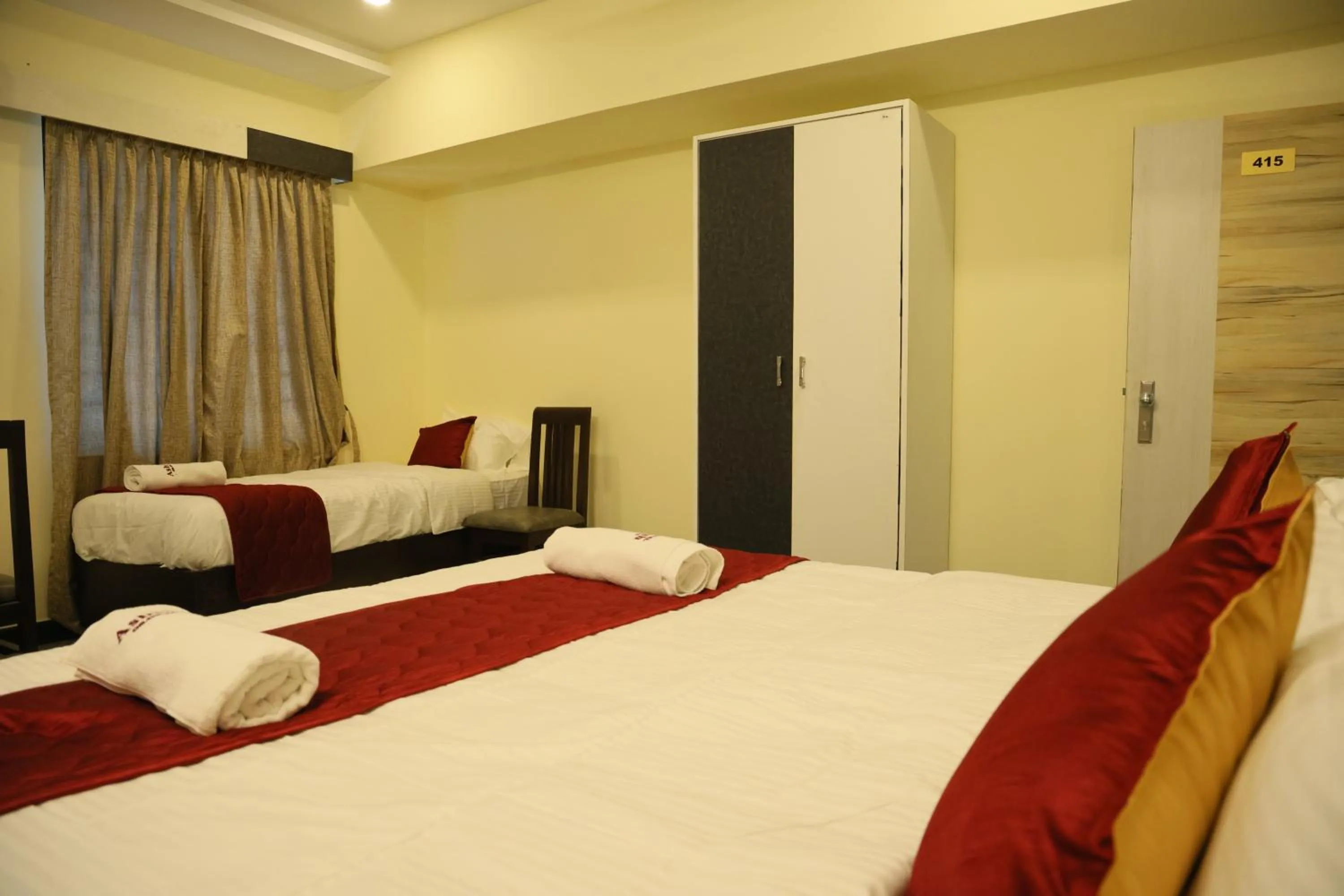 Bed in Hotel Ashlesh Manipal