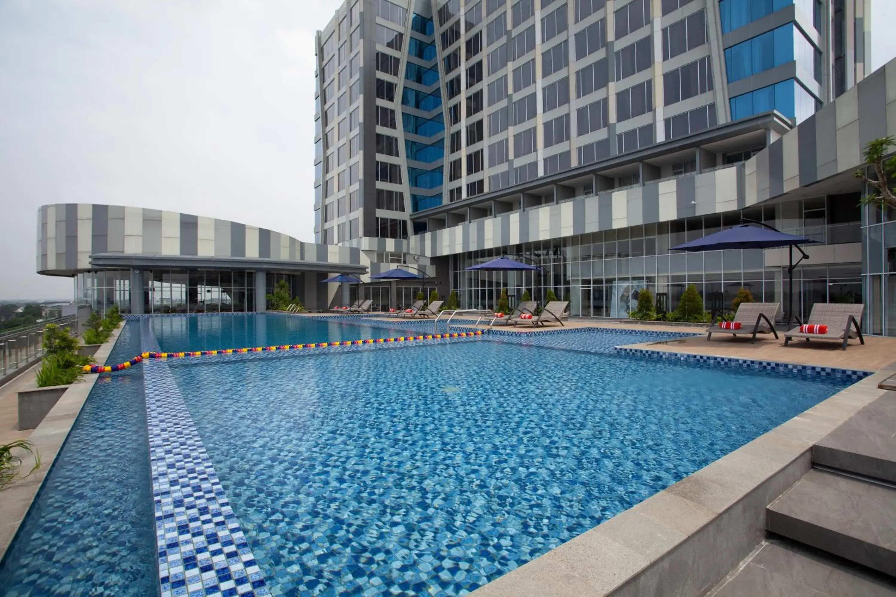 Swimming pool in HARRIS Hotel & Convention Cibinong City Mall Bogor Swimming pool in HARRIS Hotel & Convention Cibinong City Mall Bogor