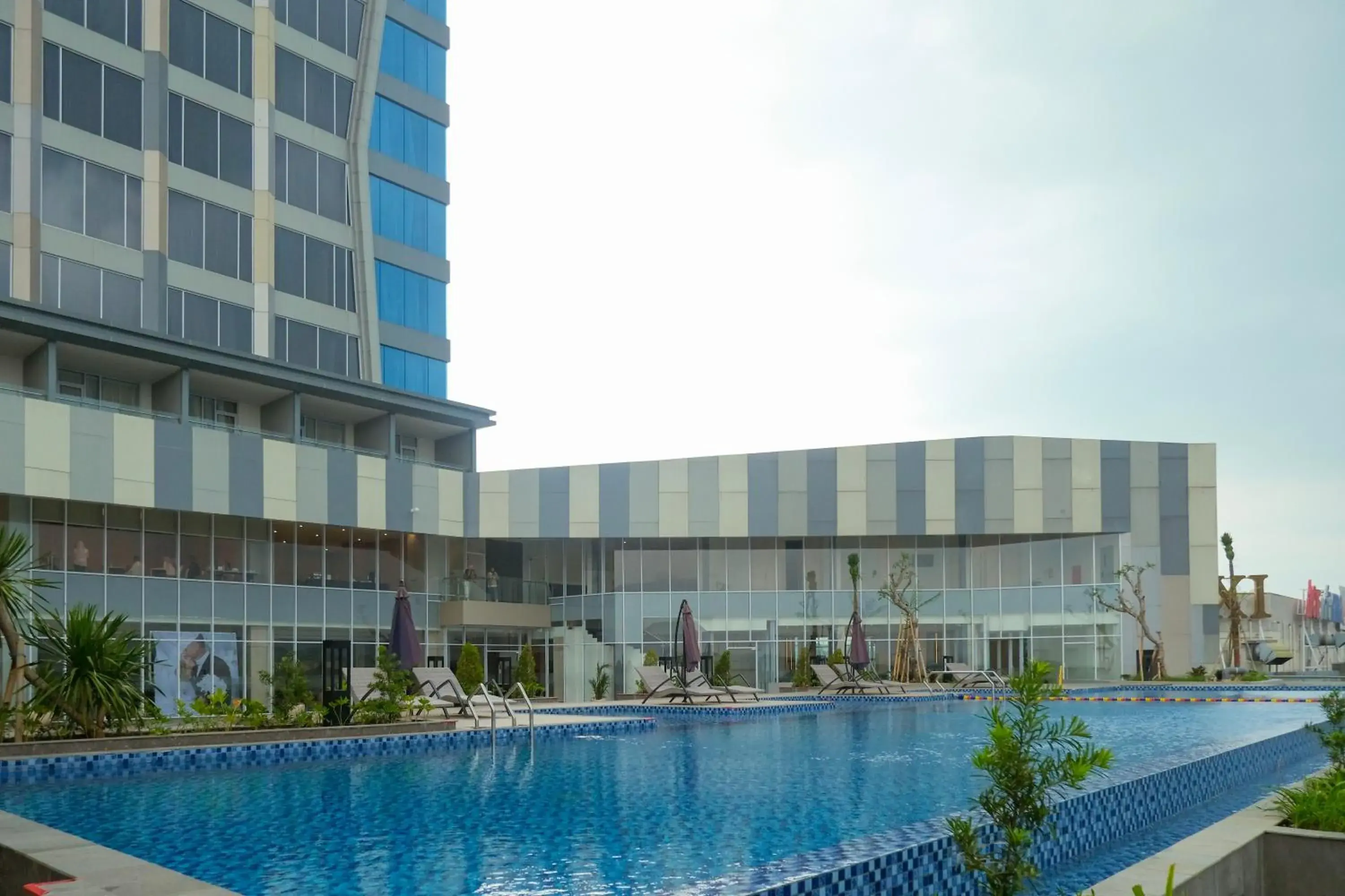 Swimming pool in HARRIS Hotel & Convention Cibinong City Mall Bogor Swimming pool in HARRIS Hotel & Convention Cibinong City Mall Bogor
