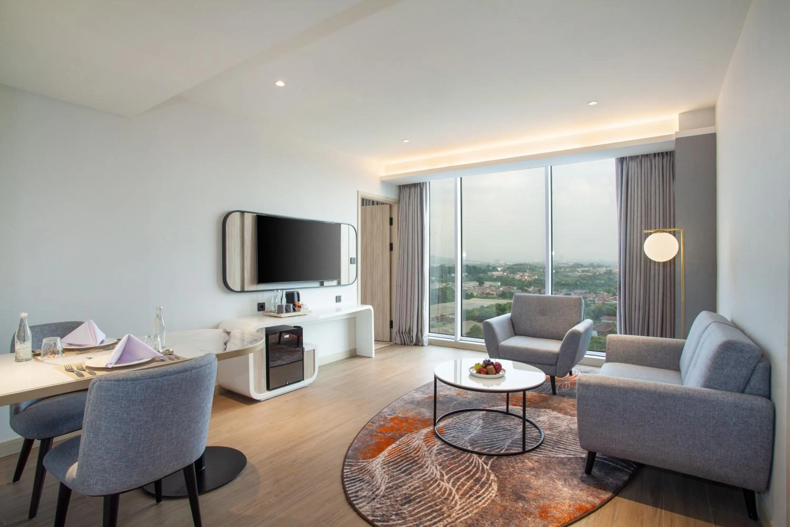 Living room in HARRIS Hotel & Convention Cibinong City Mall Bogor