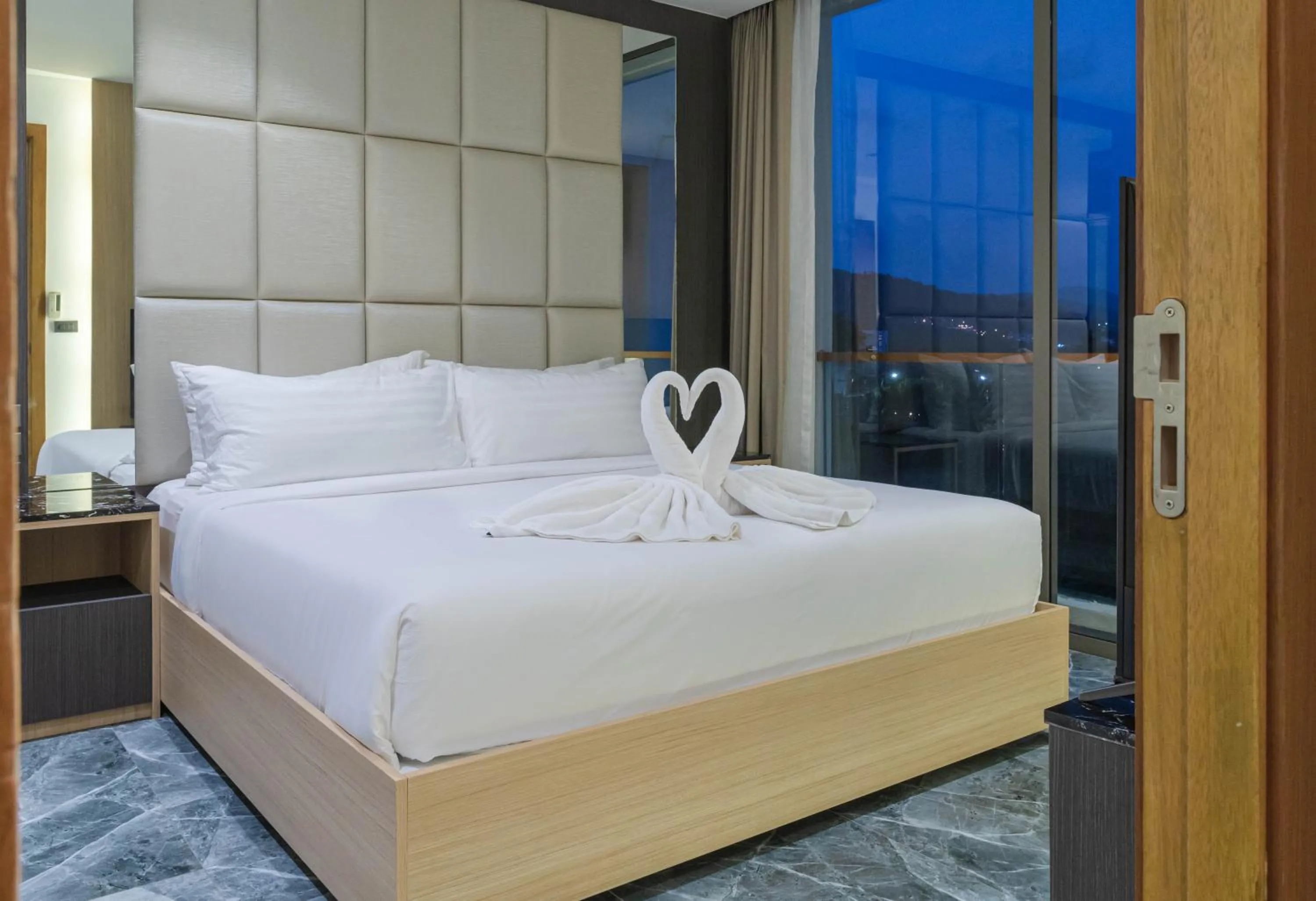 Bed in Elite Atoll Serviced Apartments Phuket