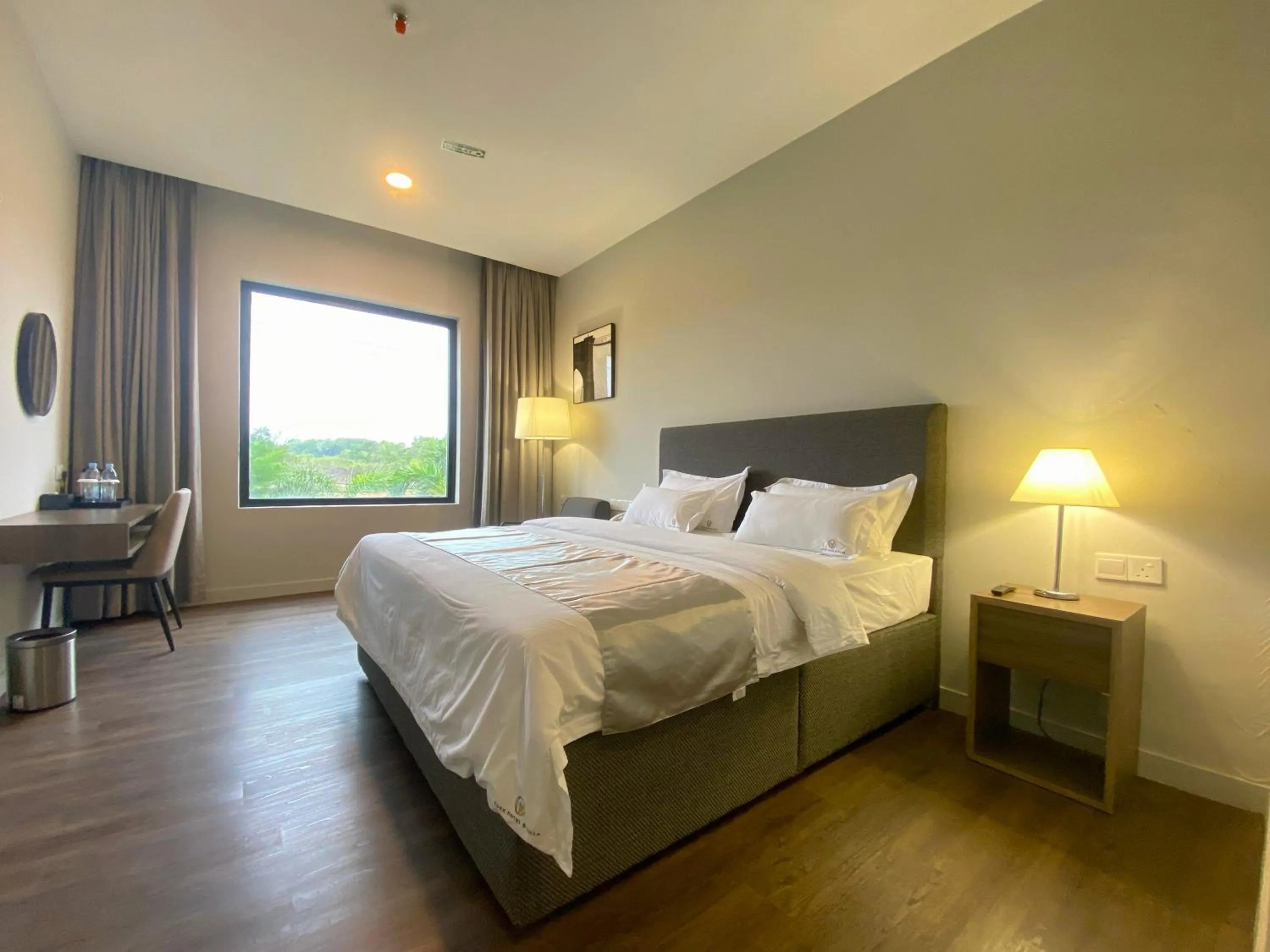 Bed in ONYX HOTEL & VILLA