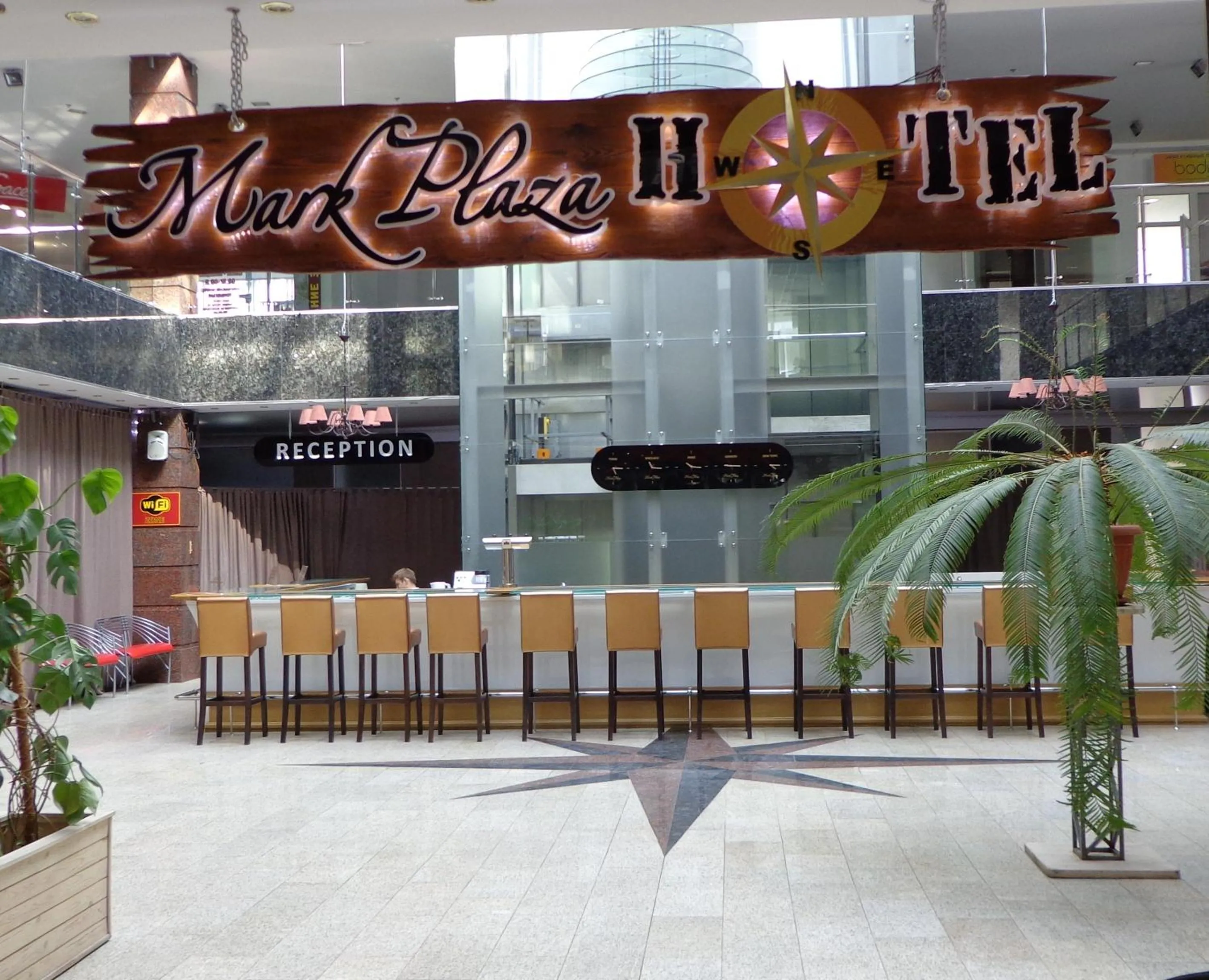 Property logo or sign in Mark Plaza Hotel