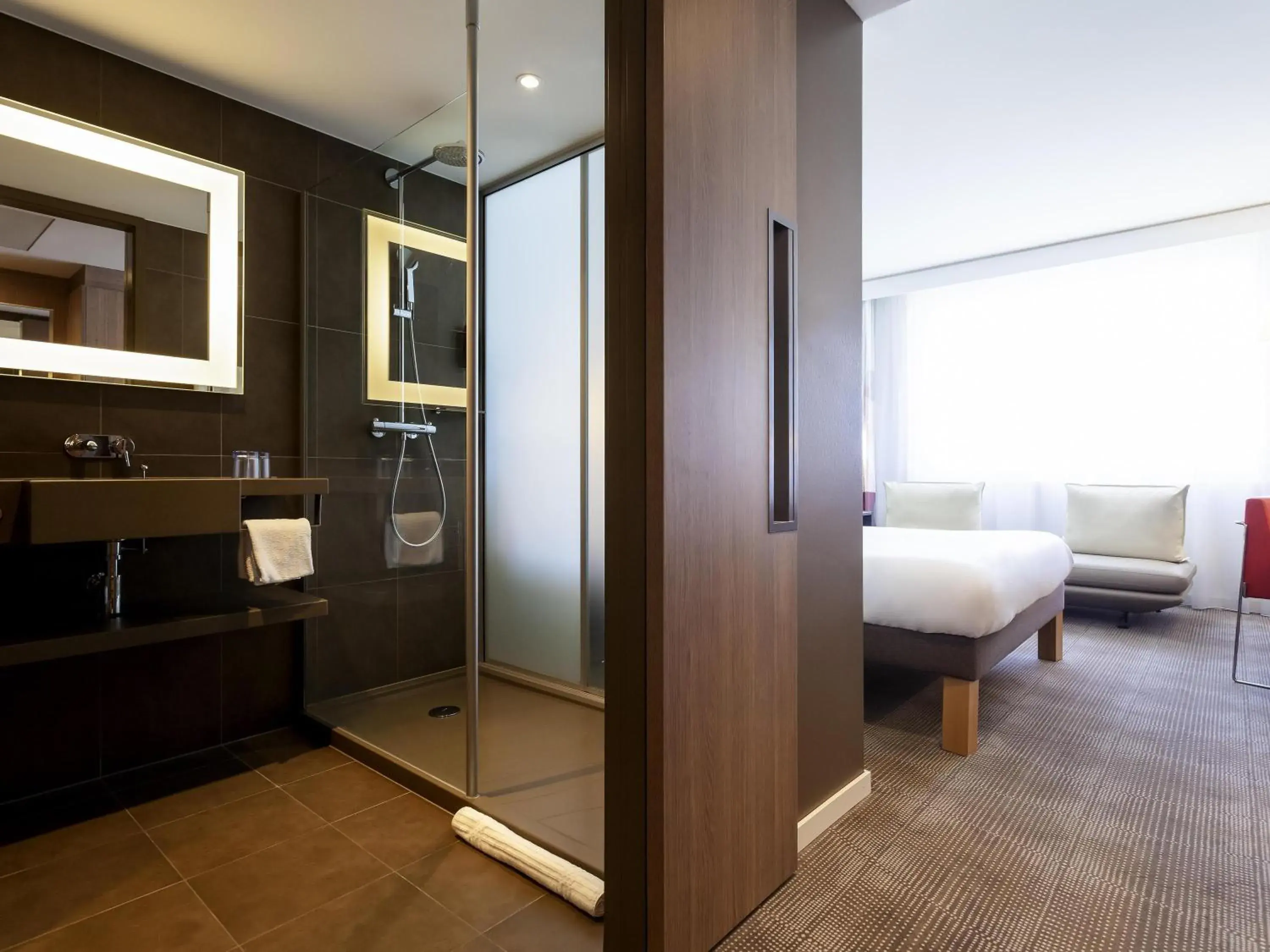 Shower, Bed in Novotel Basel City Shower, Bed in Novotel Basel City