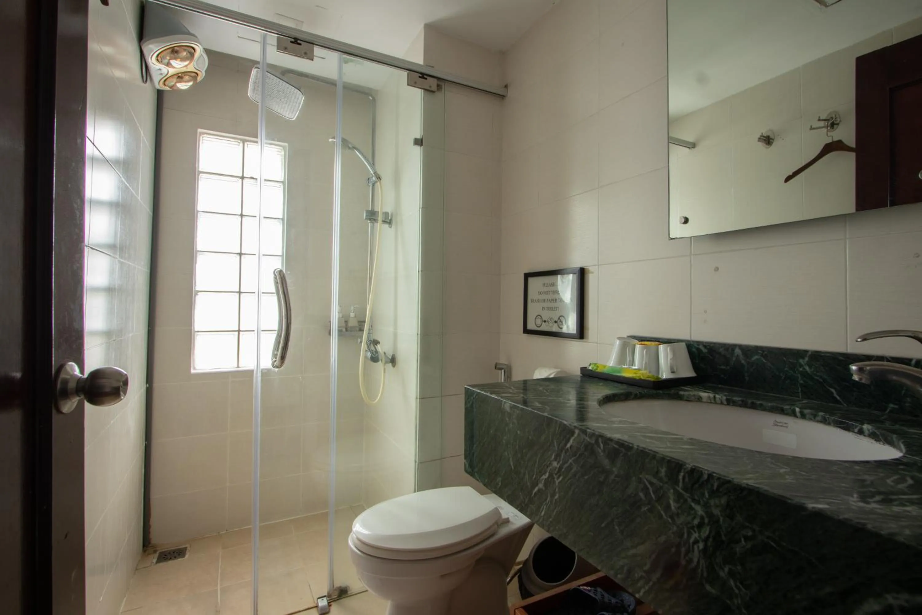 Toilet in NT Elysian hotel