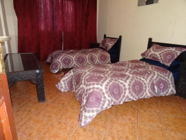 Property building, Bed in Manis Apartment Set in a Hotel Area