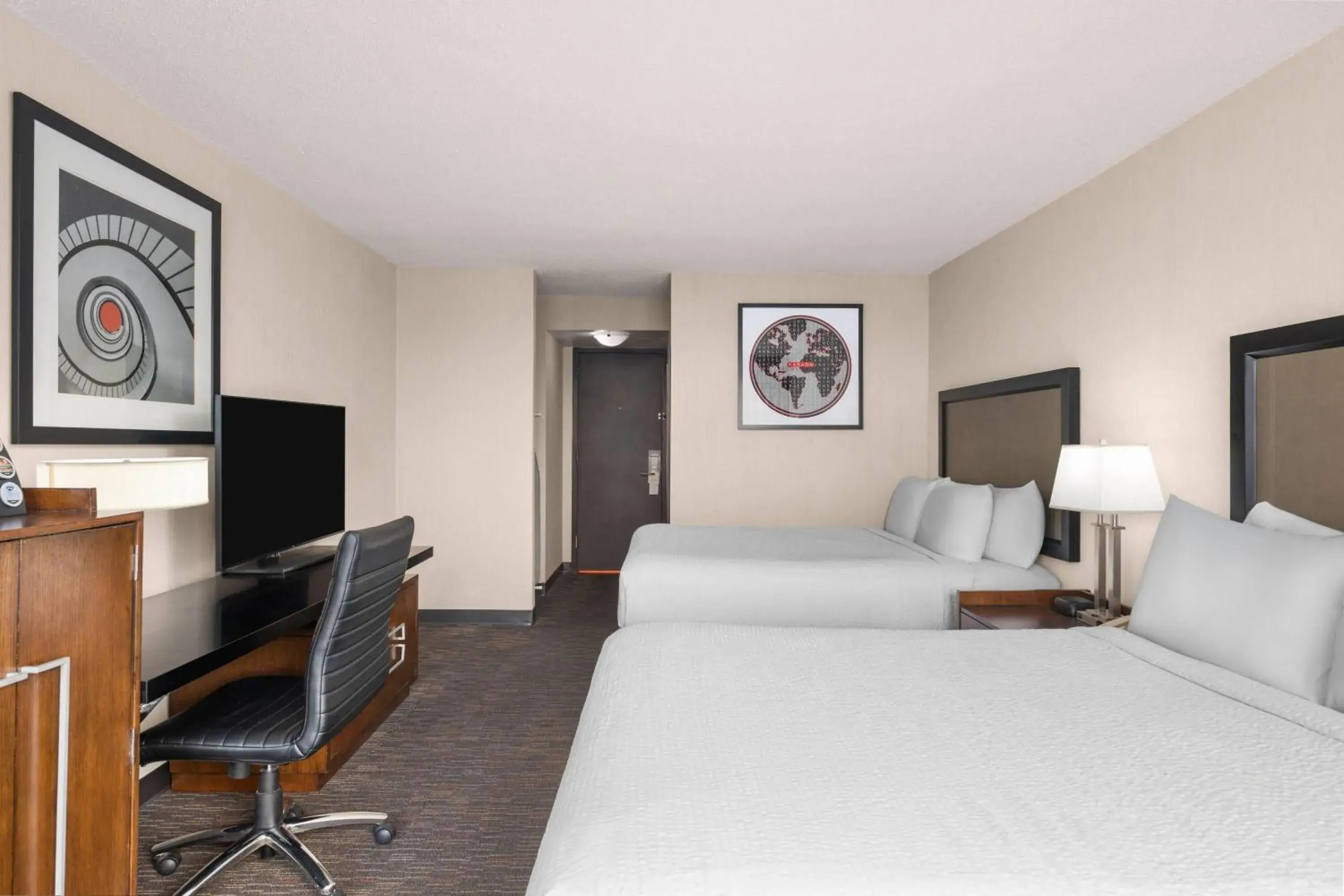 Photo of the whole room, Bed in Ramada Plaza by Wyndham Regina Downtown Photo of the whole room, Bed in Ramada Plaza by Wyndham Regina Downtown